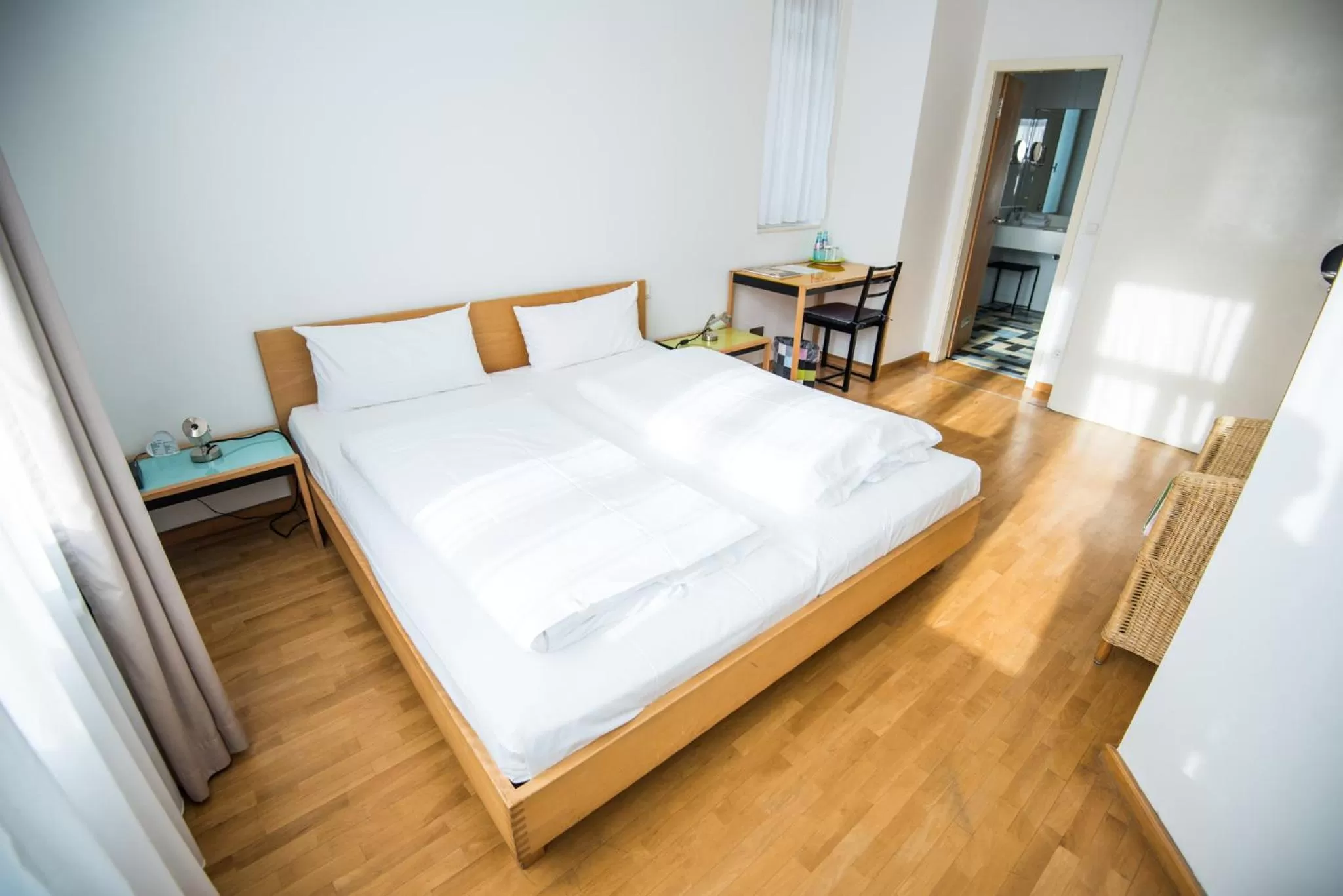 Bed in Art-Hotel Robert Mayer