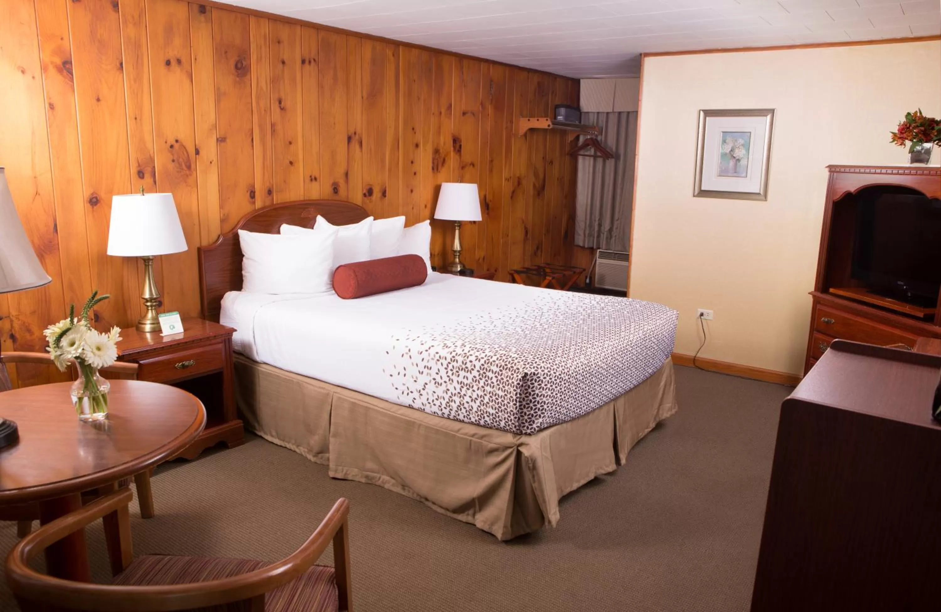 Bed in Knotty Pine Motel