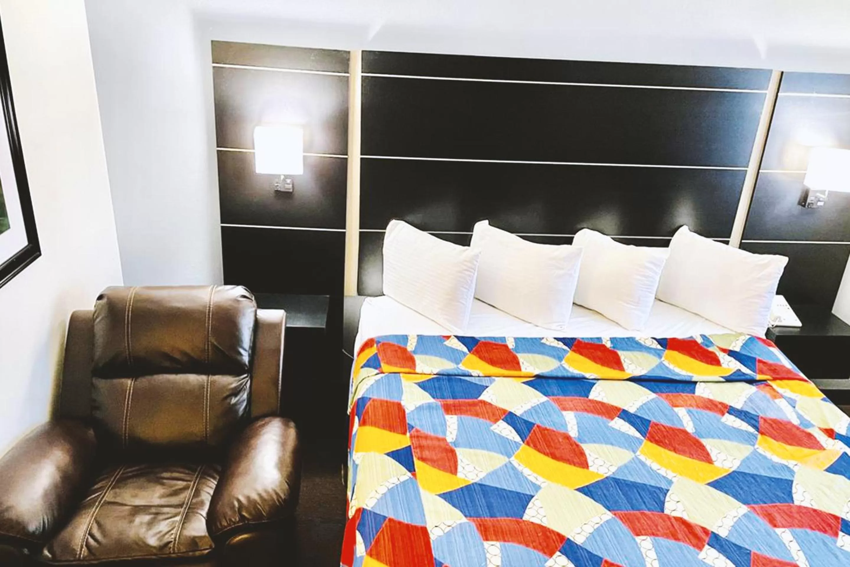 Bed in Coratel Inn & Suites by Jasper Northfield