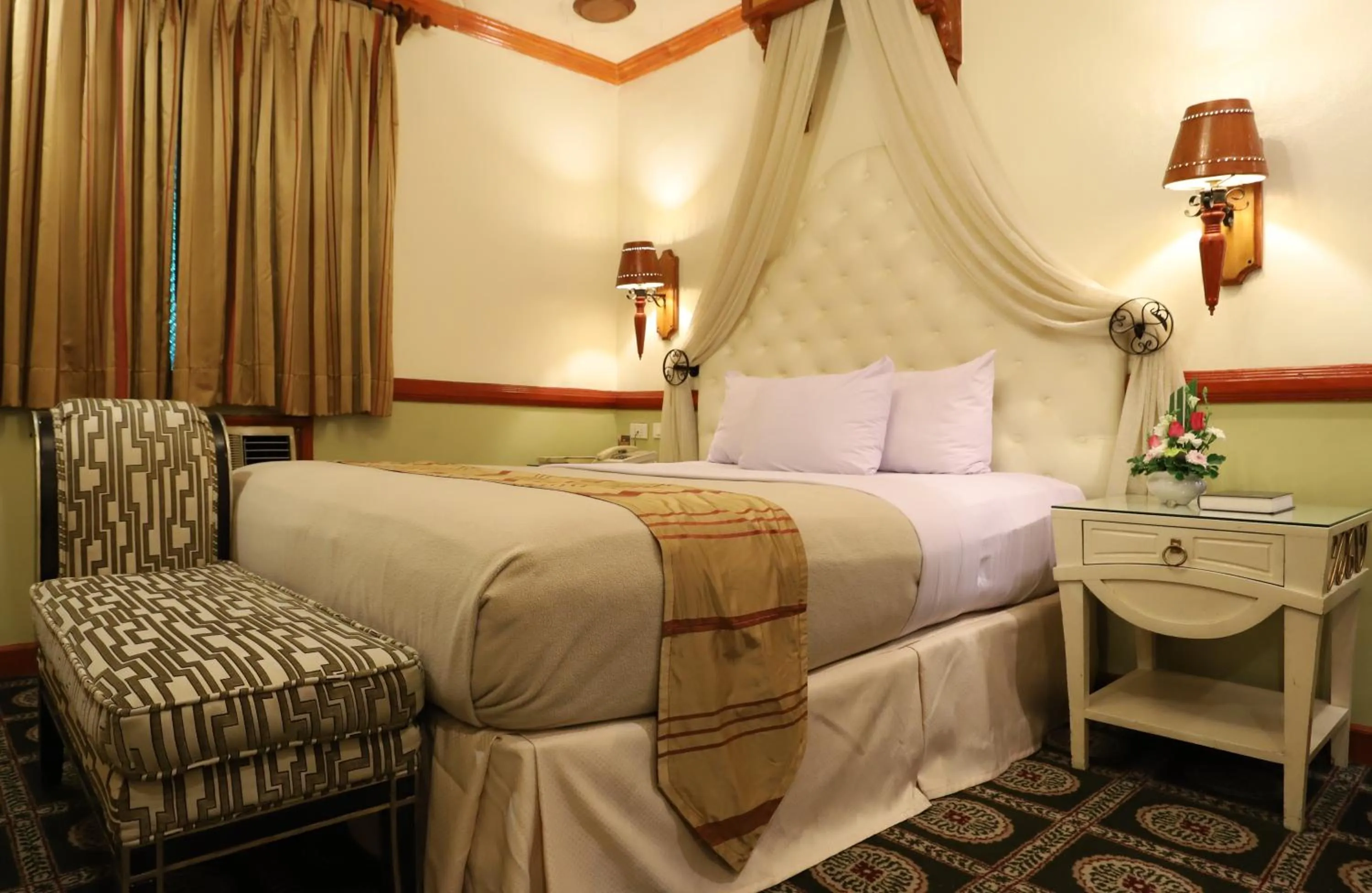 Bed in Camelot Hotel