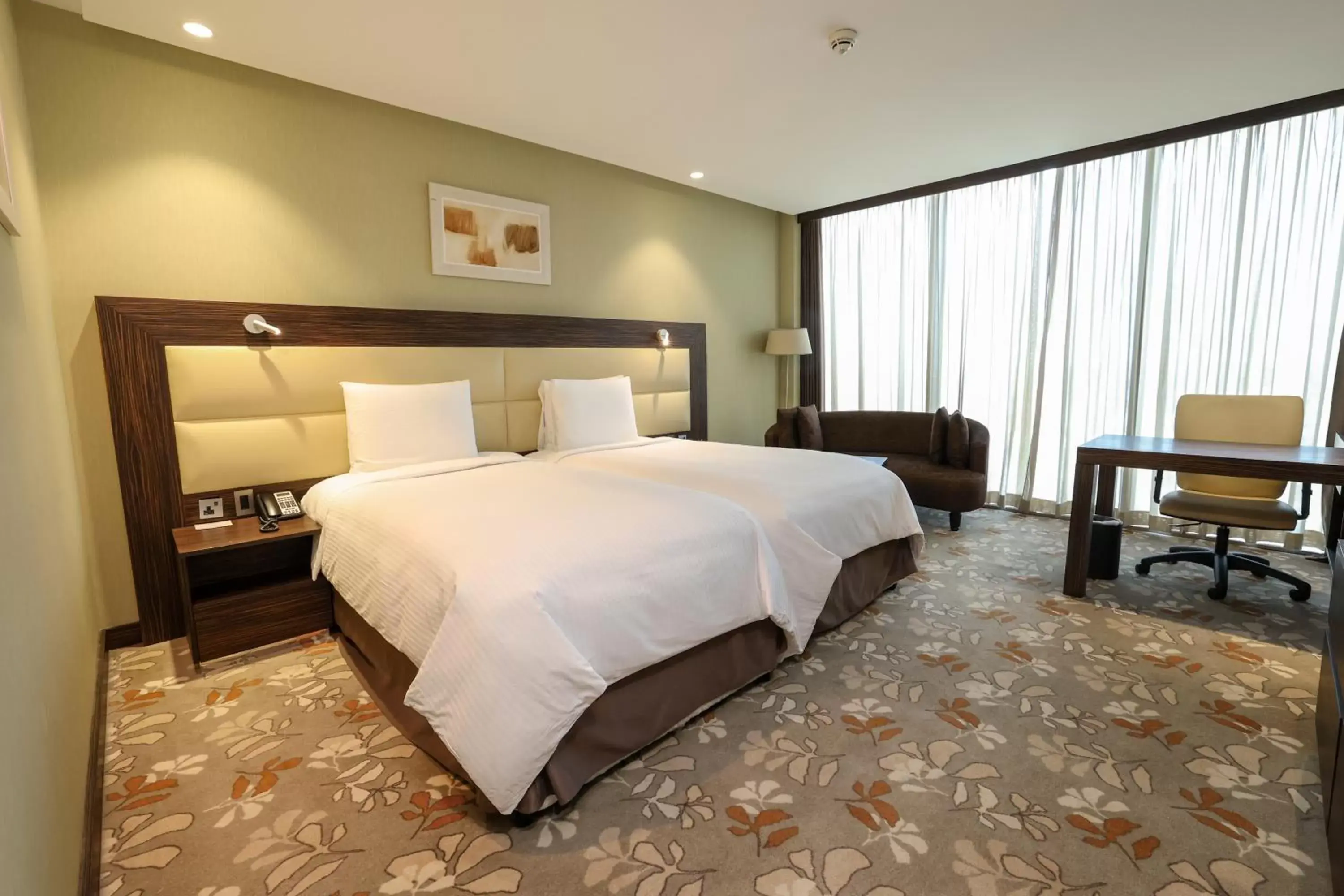 Bed in Crowne Plaza Kuwait Al Thuraya City, an IHG Hotel