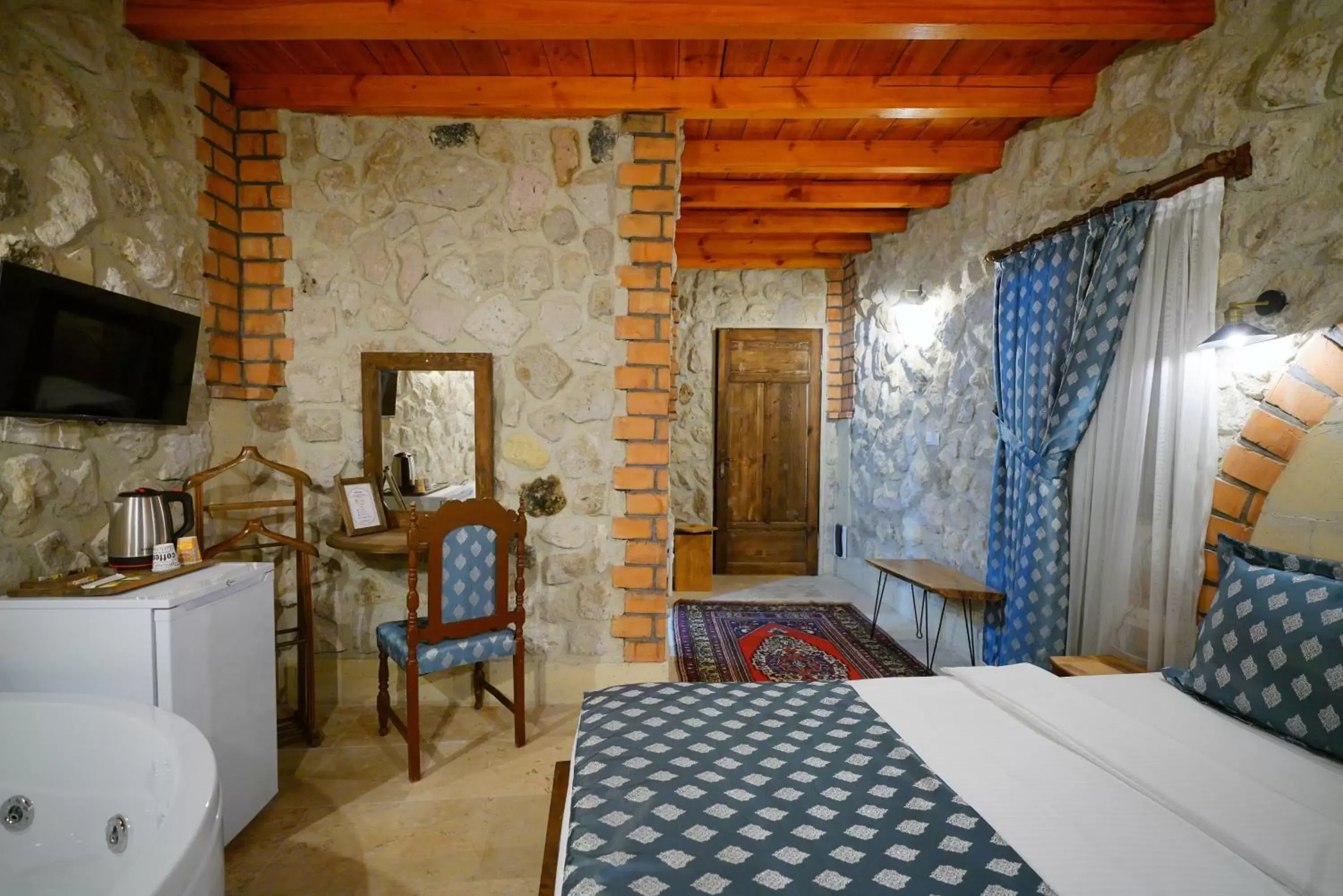 Bedroom, TV/Entertainment Center in Cappadocia Nar Cave House & Hot Swimming Pool