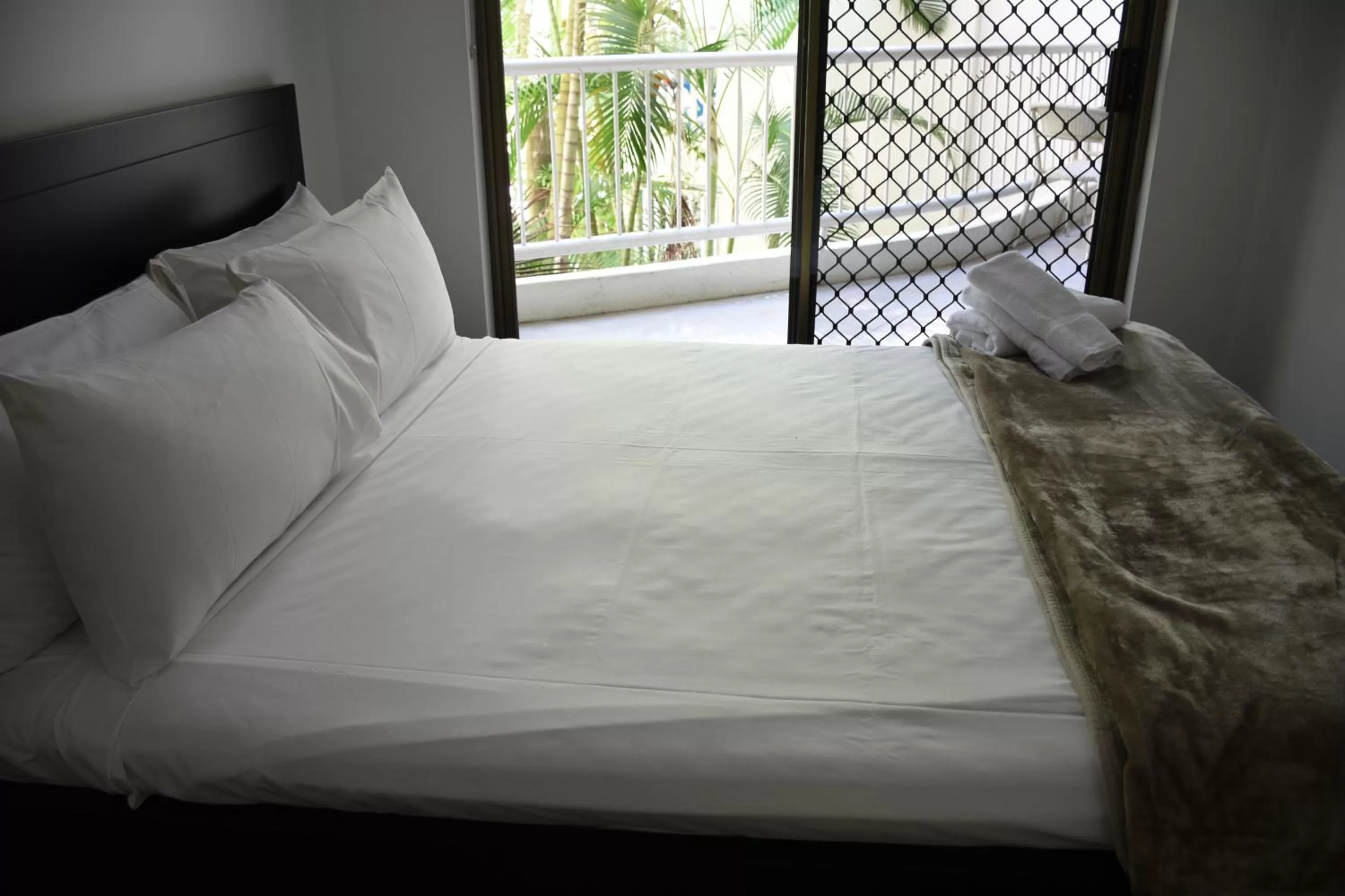 Bed in Copacabana Apartments