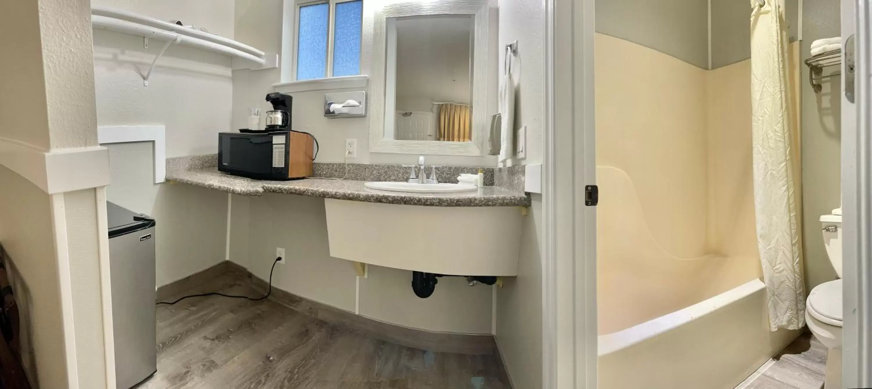 Bathroom in Americas Inn & Suite