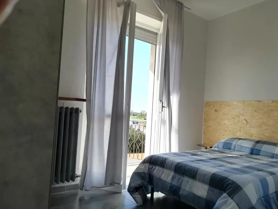 Photo of the whole room, Bed in LE MURA Foresteria