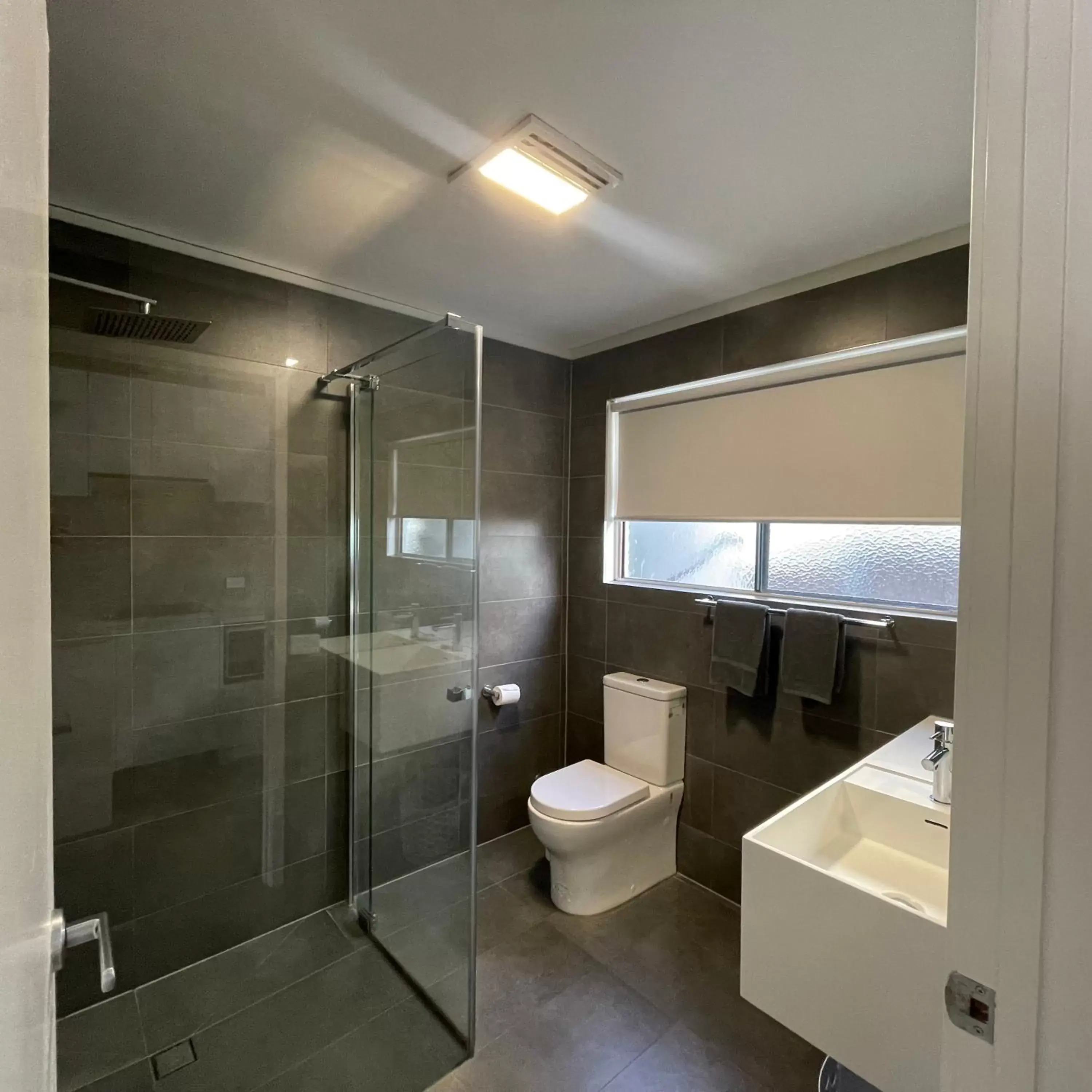 Shower, Bathroom in Coastal Motel