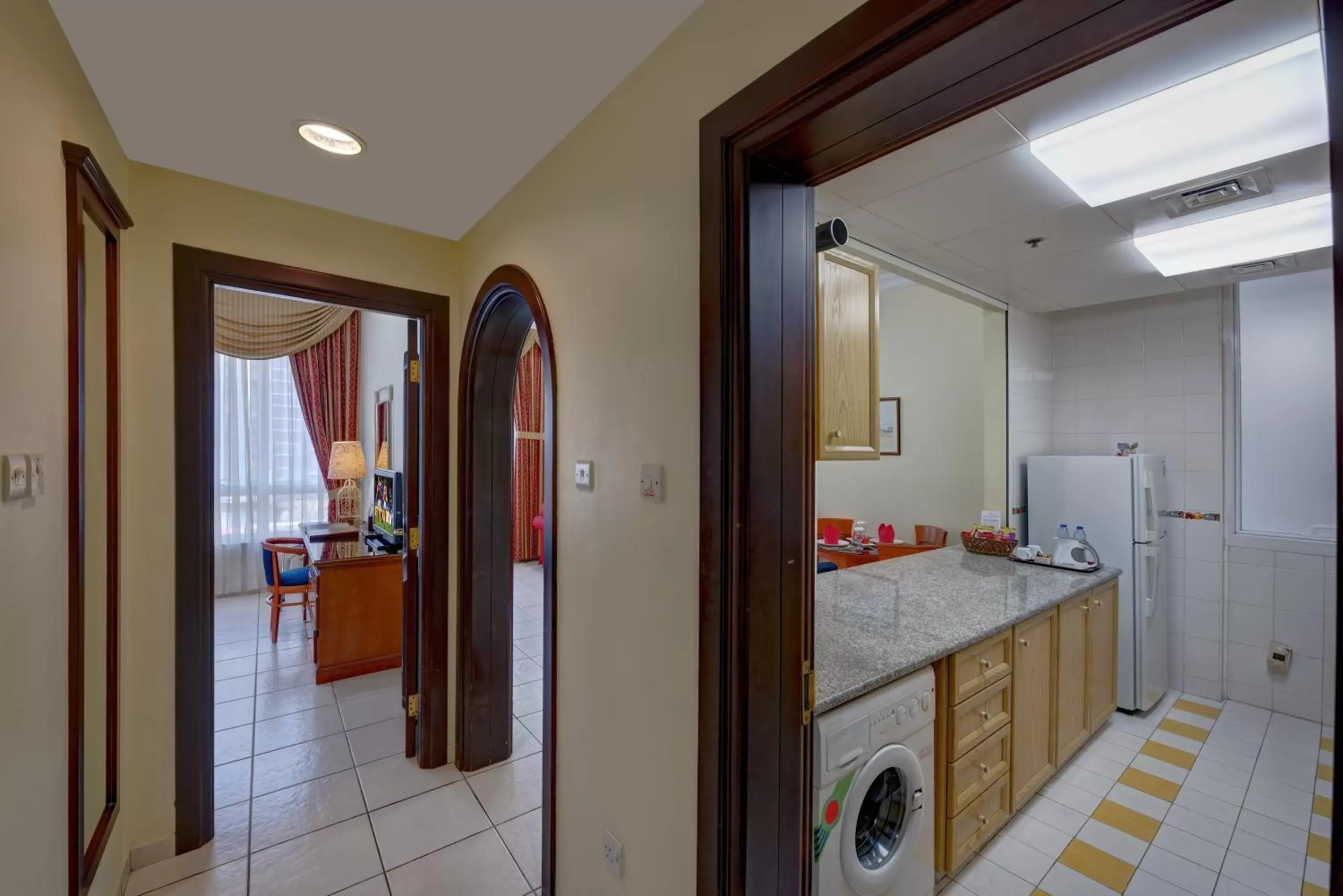 Kitchen or kitchenette, Bathroom in Al Nakheel Hotel Apartments Abu Dhabi