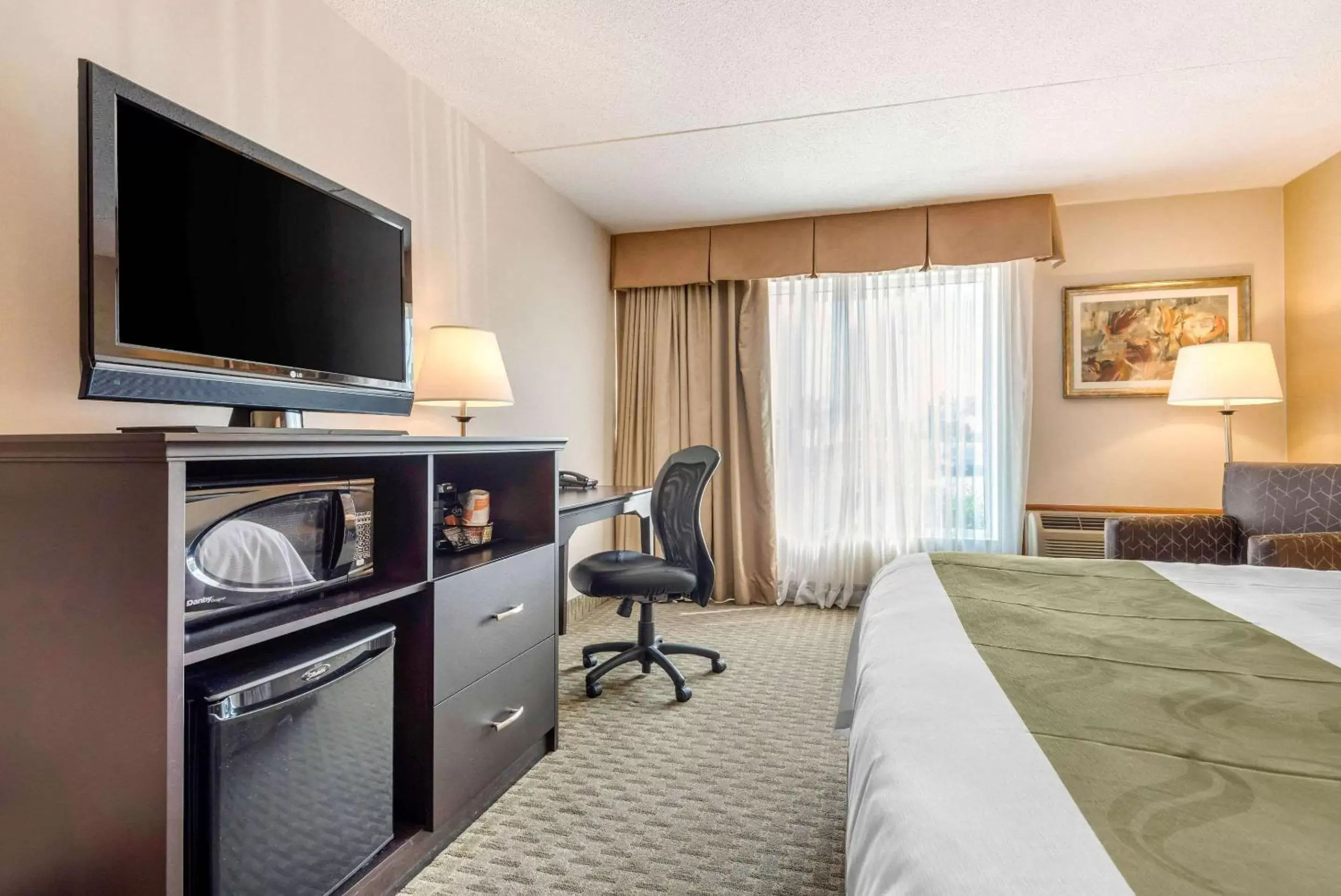 Photo of the whole room, TV/Entertainment Center in Quality Inn & Suites