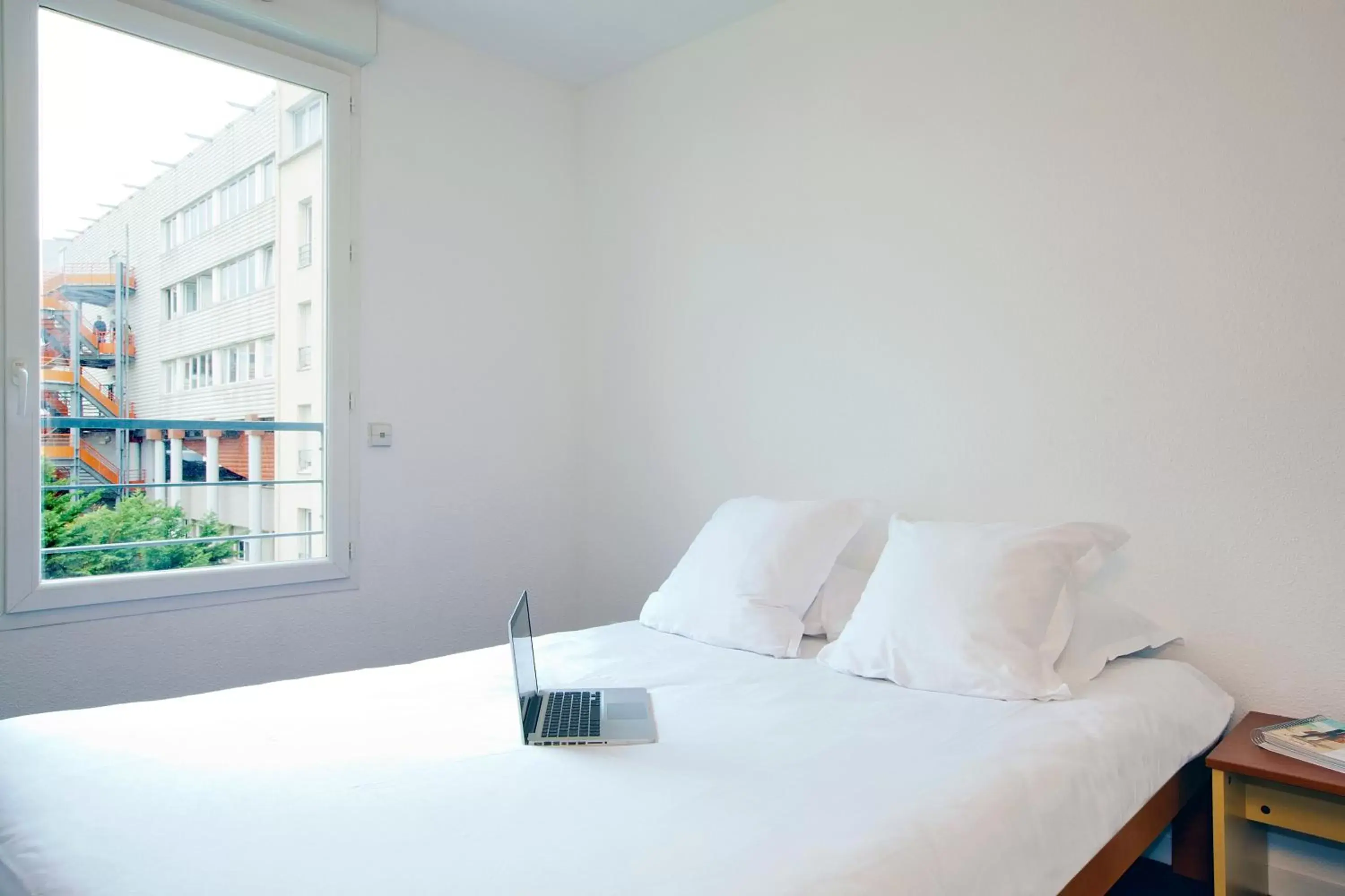 Bedroom, Bed in Séjours & Affaires Lyon Saint-Nicolas