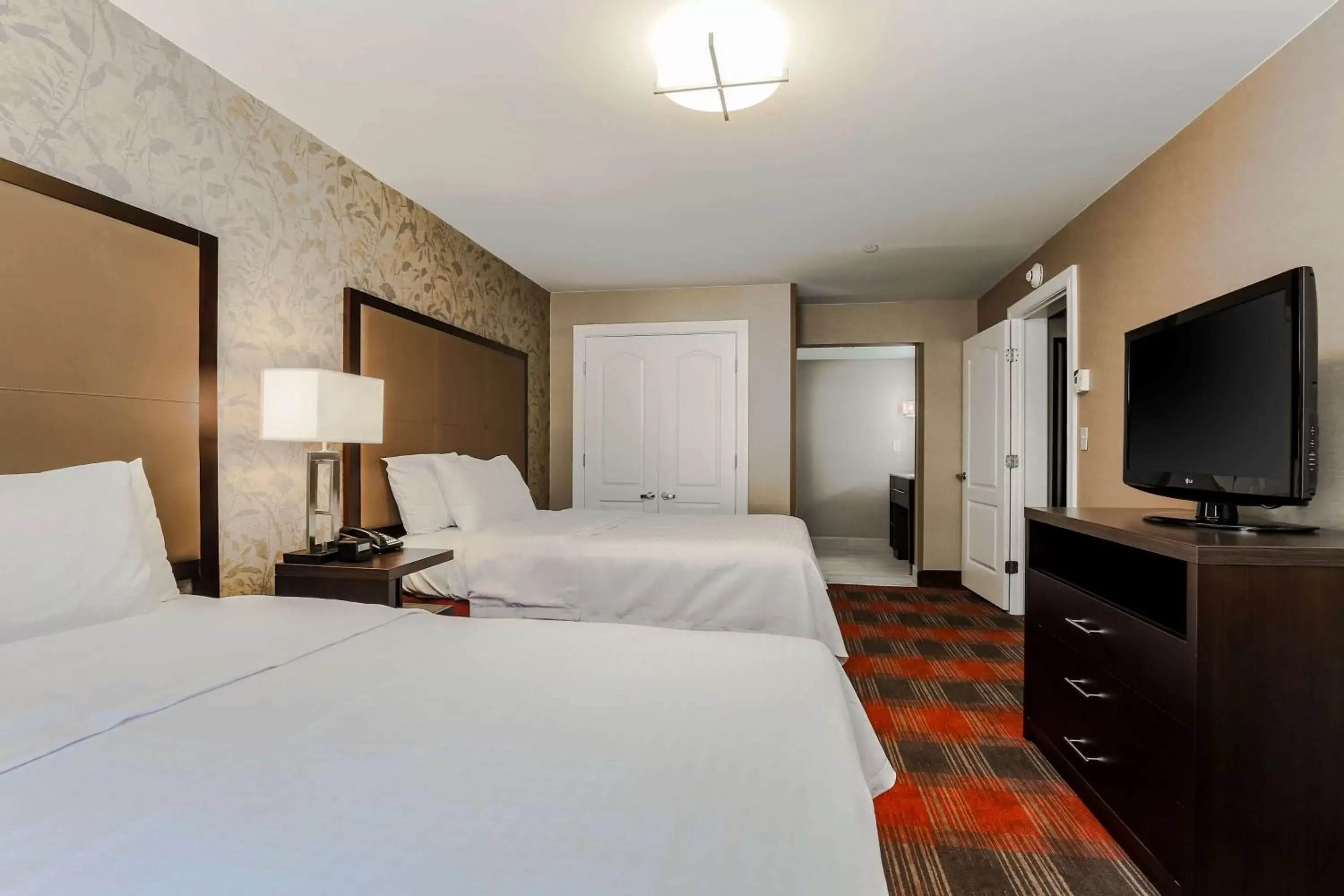 Bed in Homewood Suites by Hilton Long Island-Melville