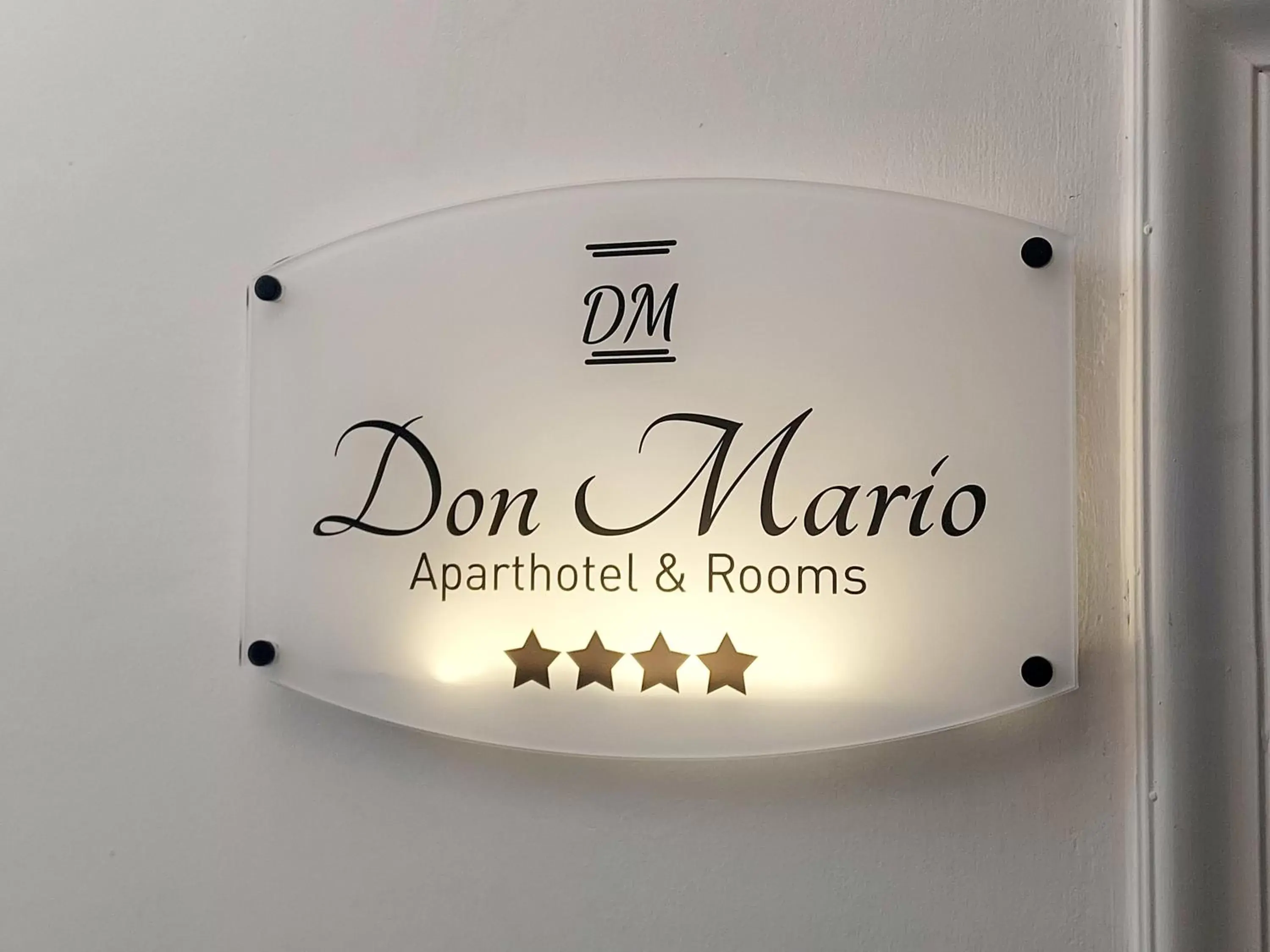 Property logo or sign in Don Mario Aparthotel & Rooms