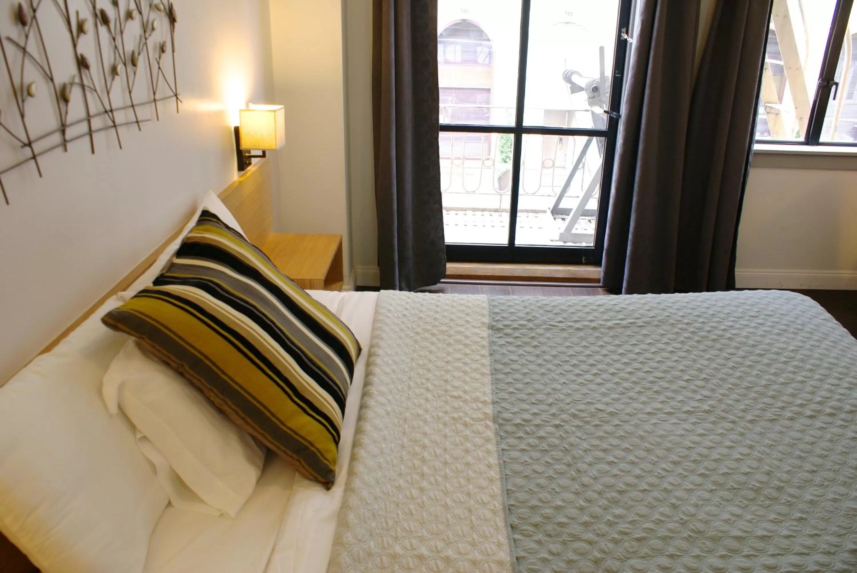 Bed in Touchstone Hotel - City Center