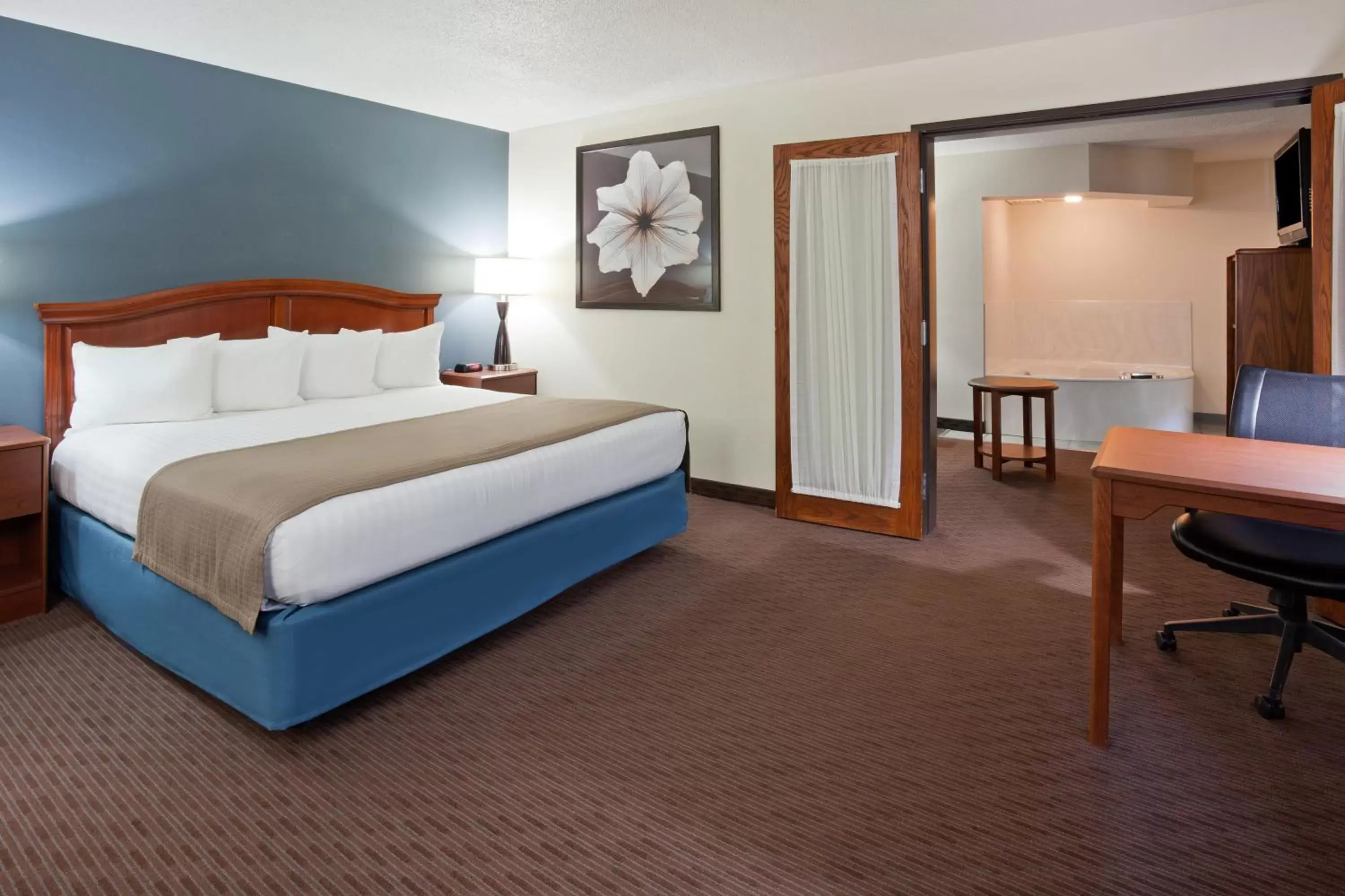 Photo of the whole room, Bed in AmericInn by Wyndham Spencer
