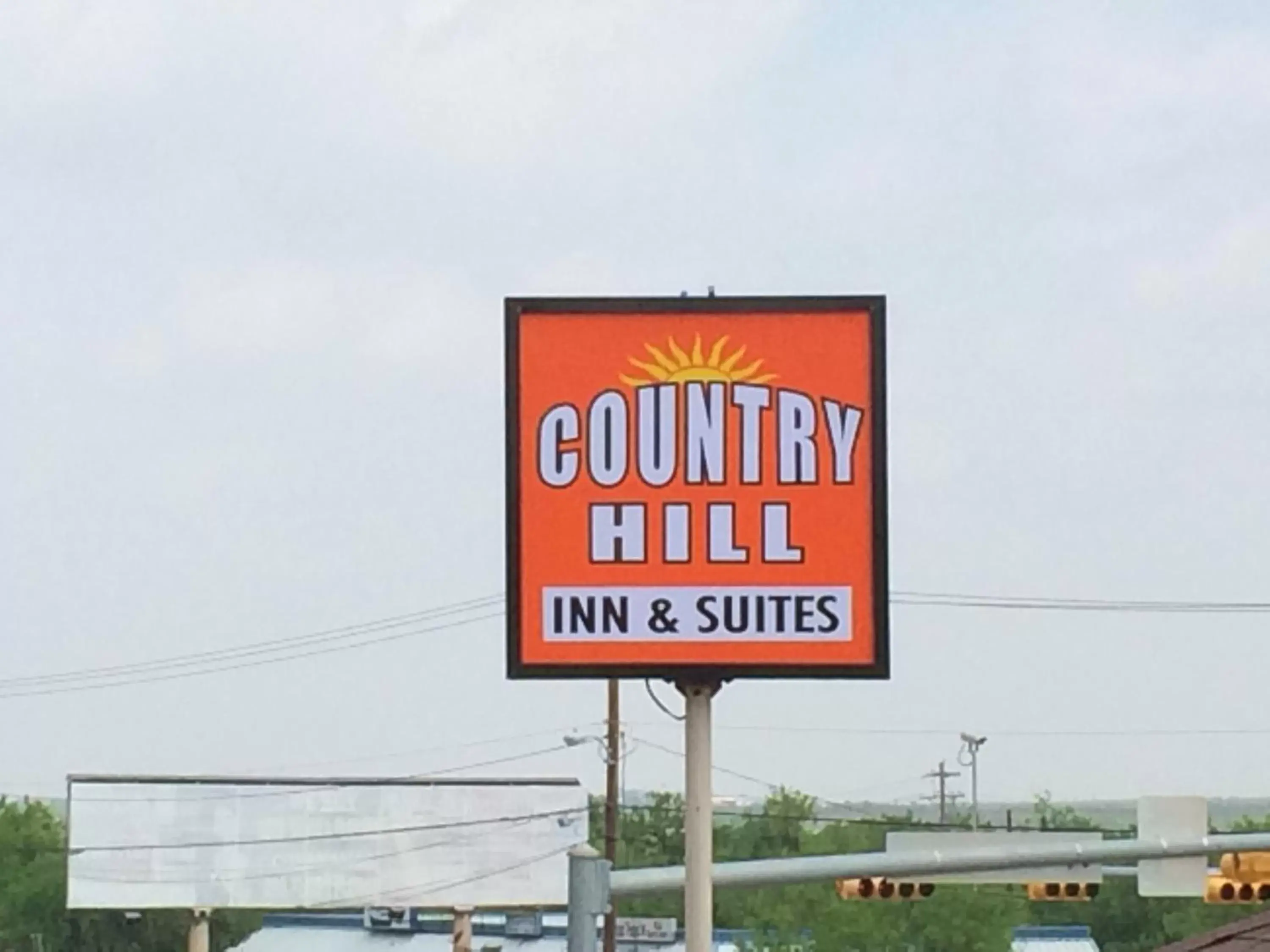 Property logo or sign in Country Hill Inn & Suite Eagle Pass