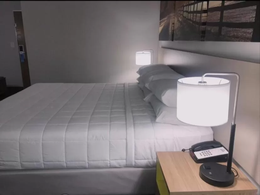 Bed in Days Inn & Suites by Wyndham Lexington