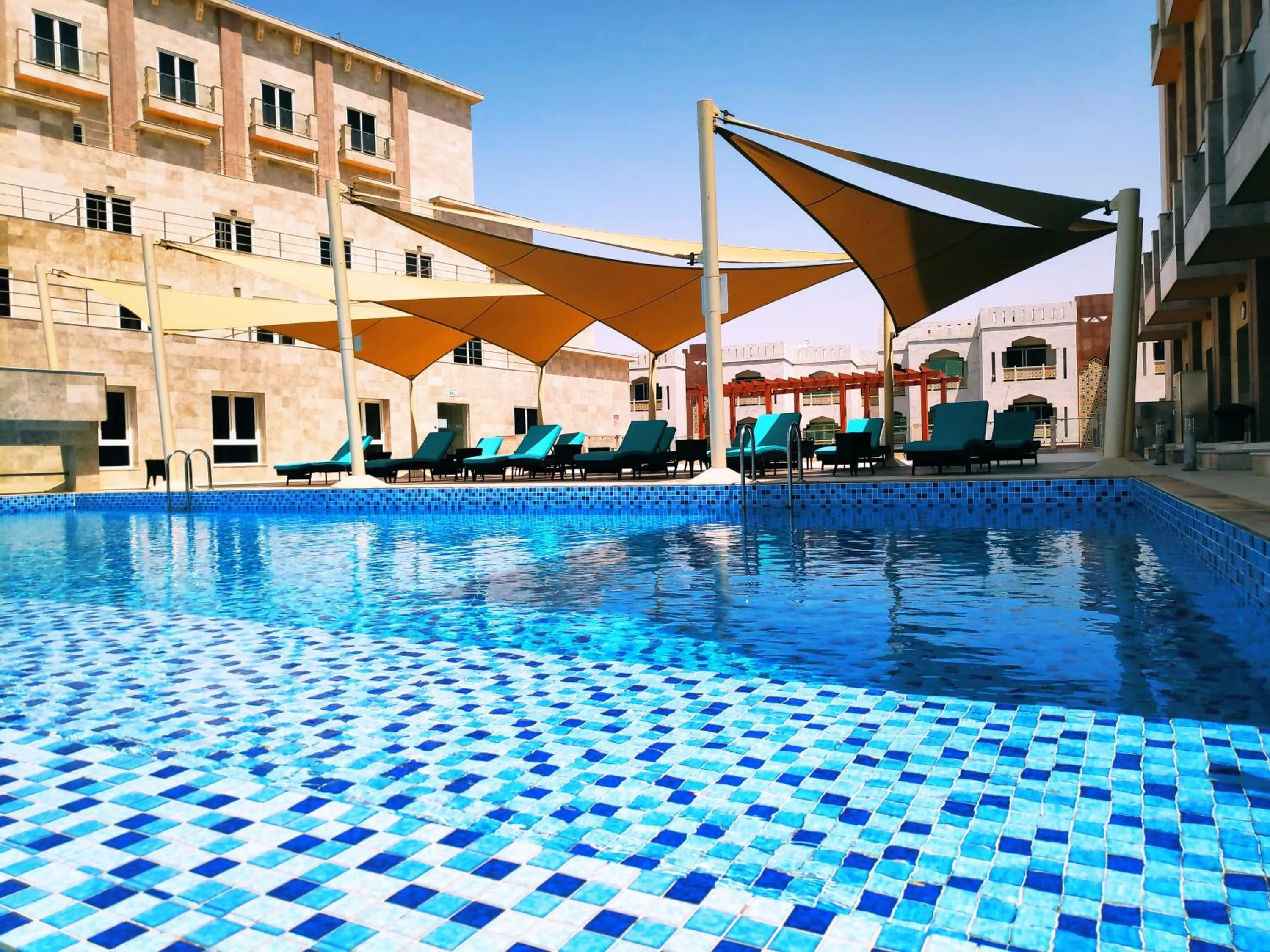 Pool view in Levatio Suites Muscat, a member of Radisson Individuals