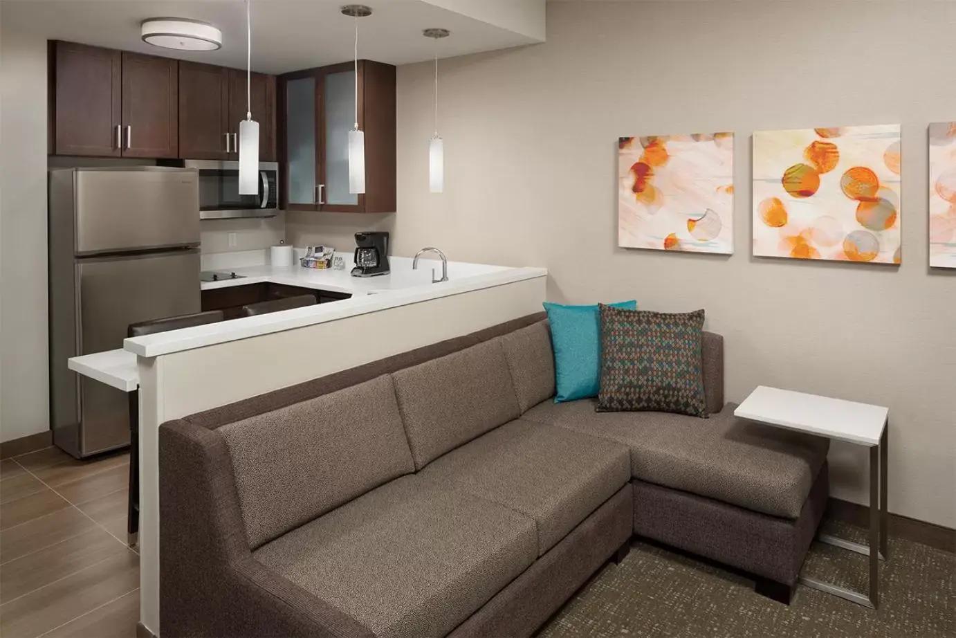 Living room, Kitchen/Kitchenette in Residence Inn by Marriott Ontario Rancho Cucamonga