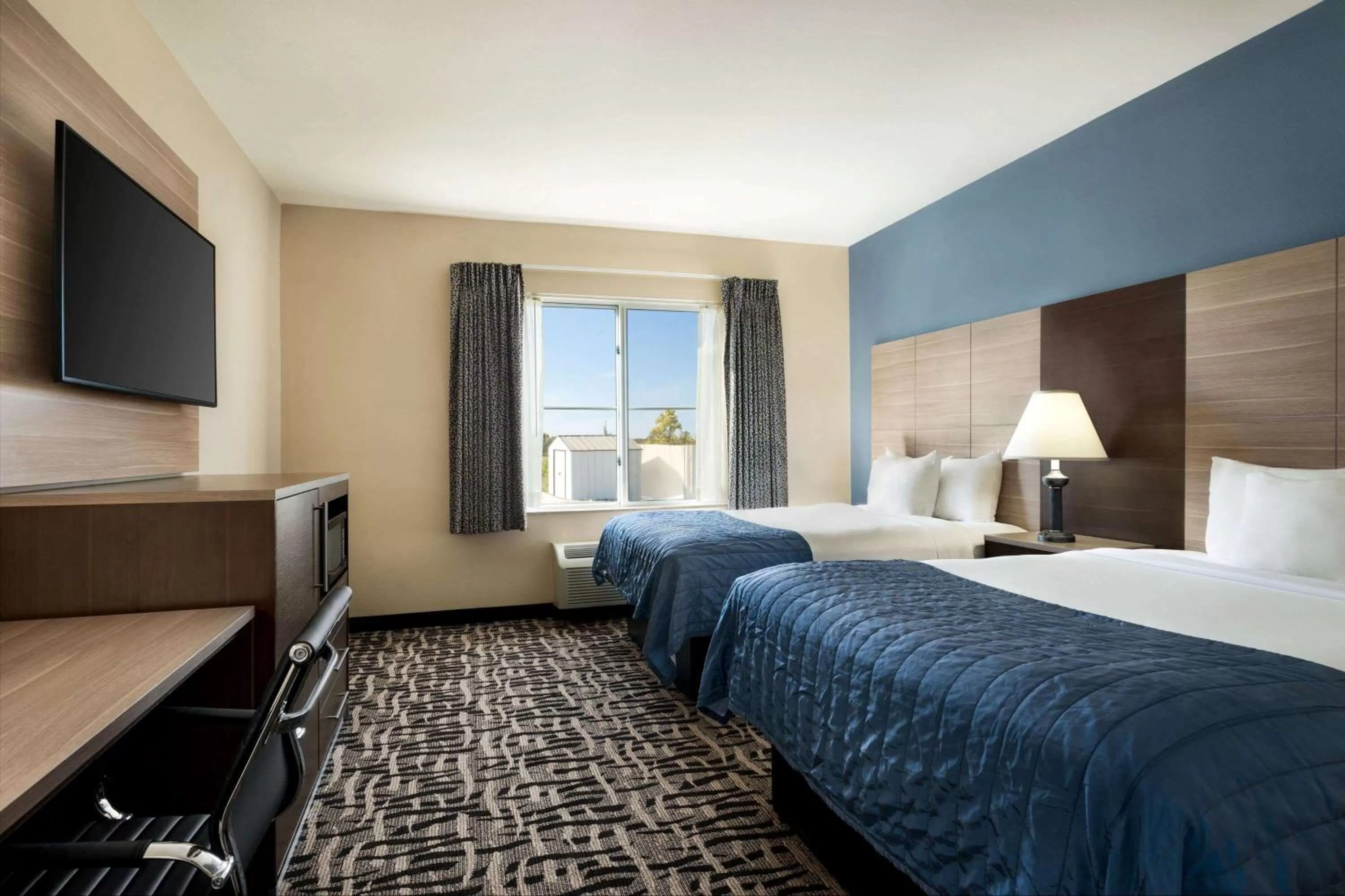 Photo of the whole room, Bed in Baymont by Wyndham Ft. Leonard/Saint Robert