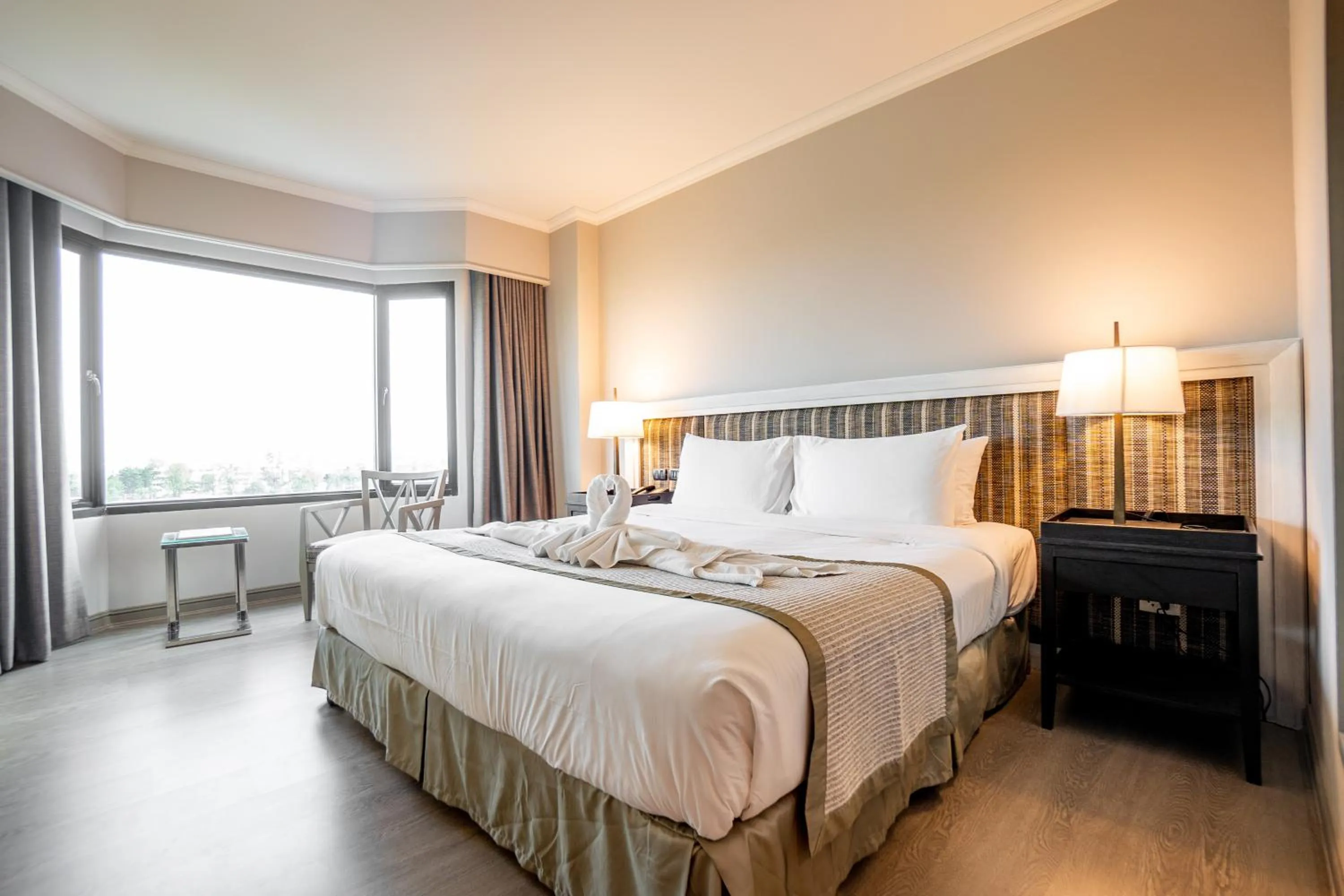 Bed in The Grand Riverside Hotel