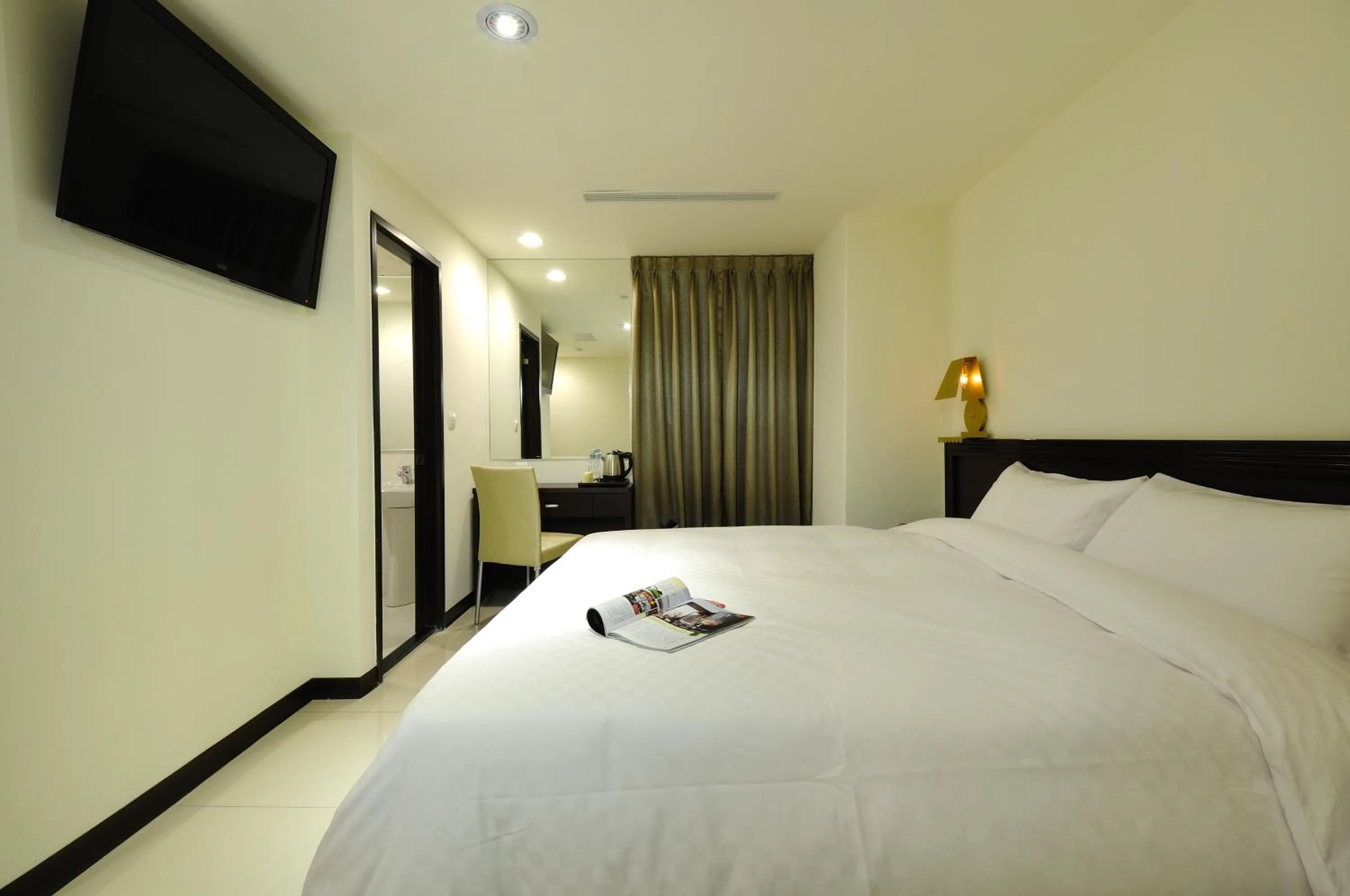 Bed in 安可旅店 Bravo Hotel