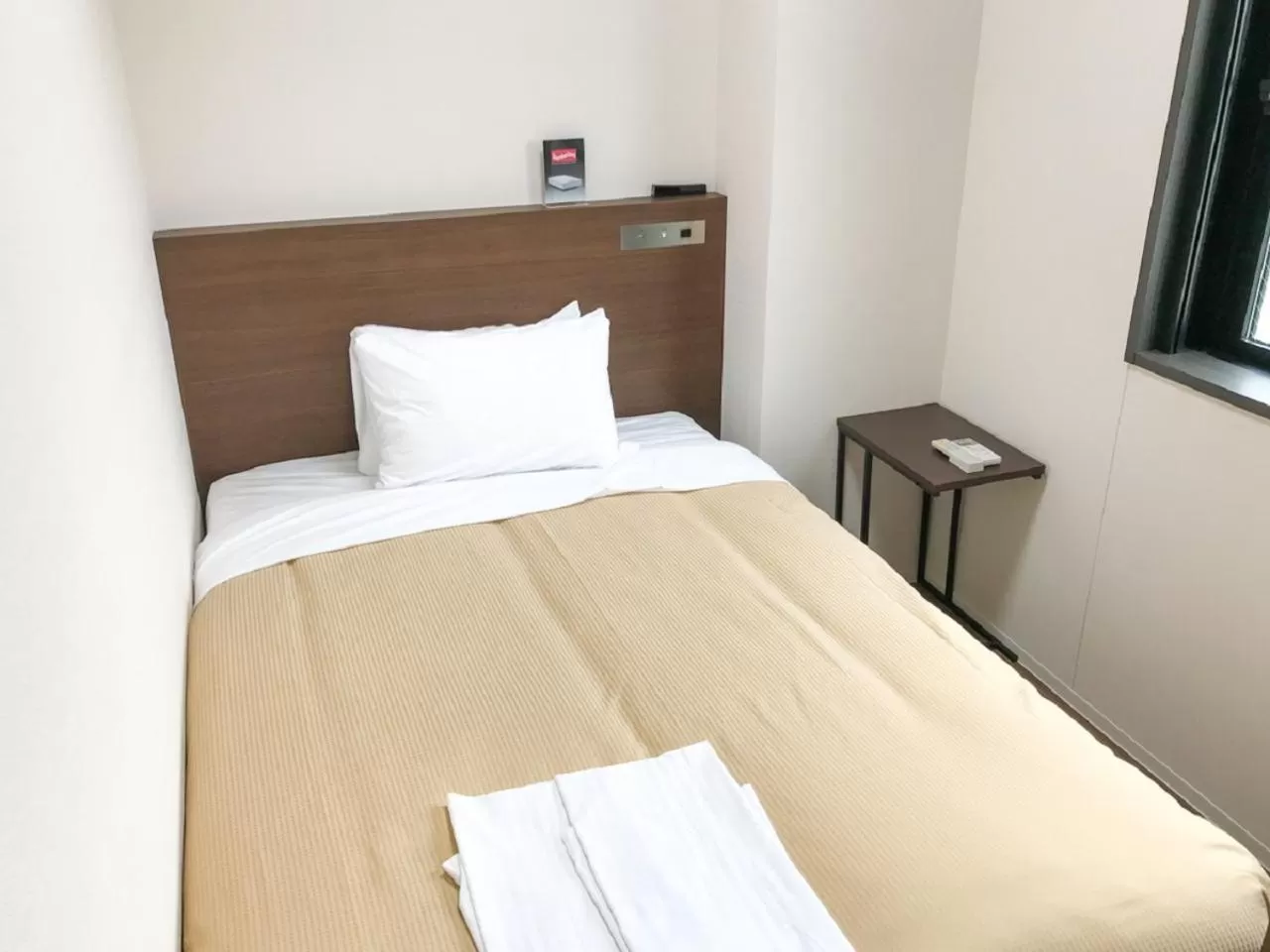 Bed in HOTEL LiVEMAX BUDGET Nagoya Shinkansen-guchi