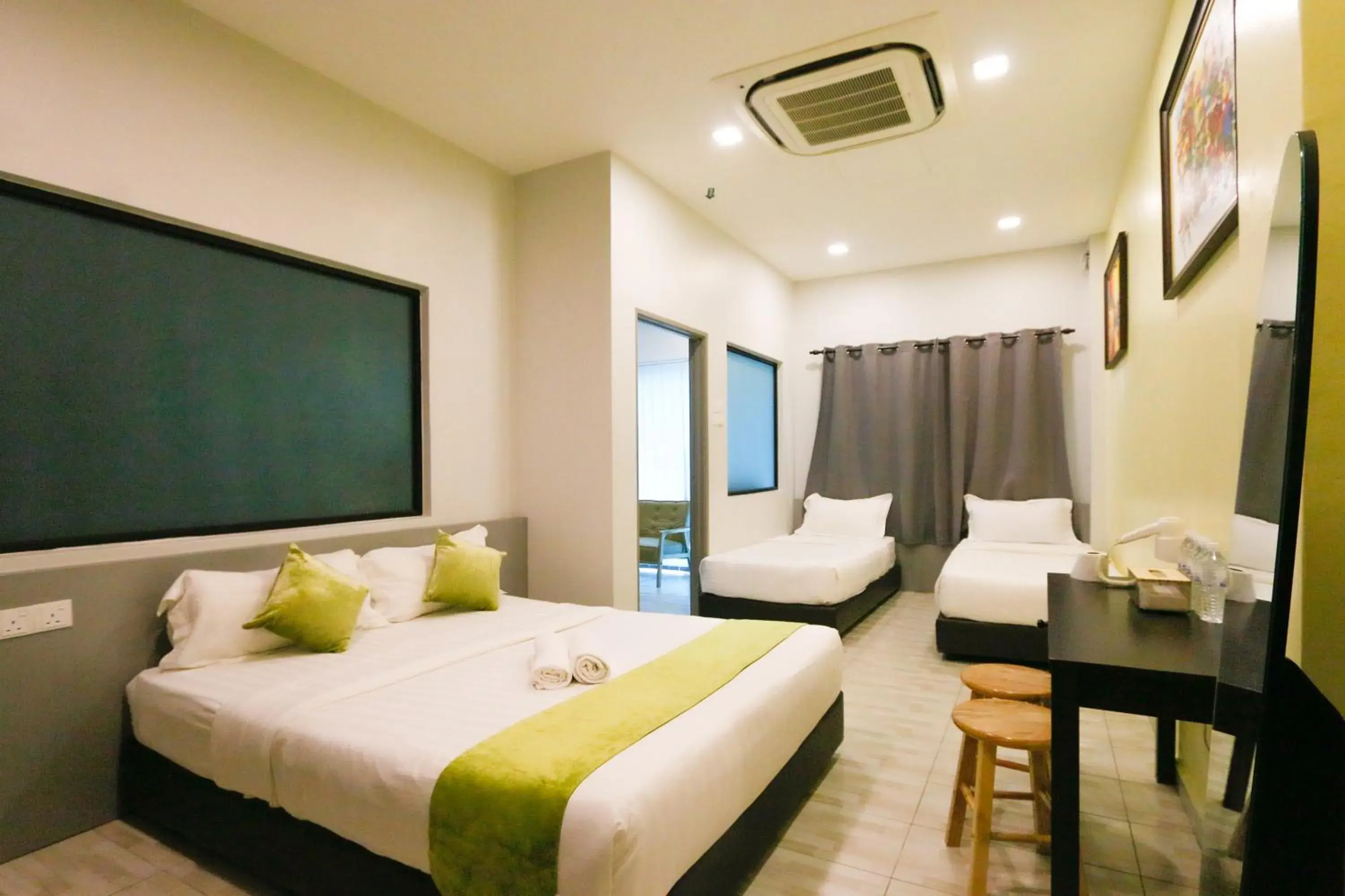 Bedroom in Travelland Hotel
