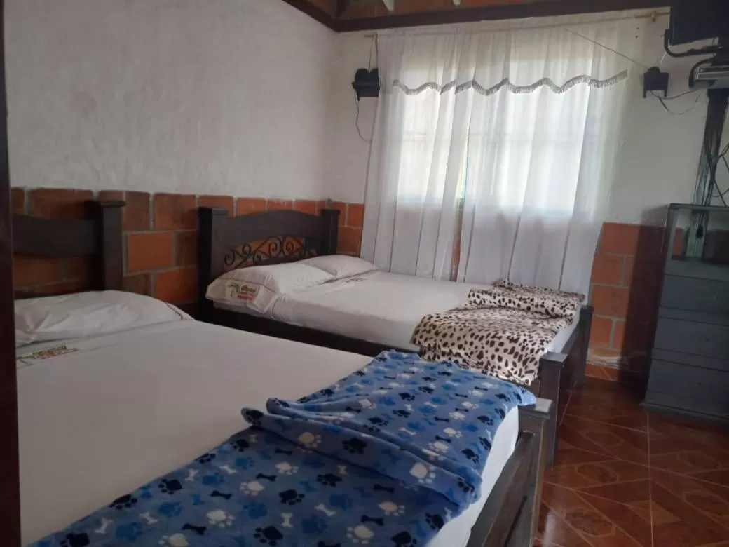 Bed in Finca Hotel Cabañas del parque