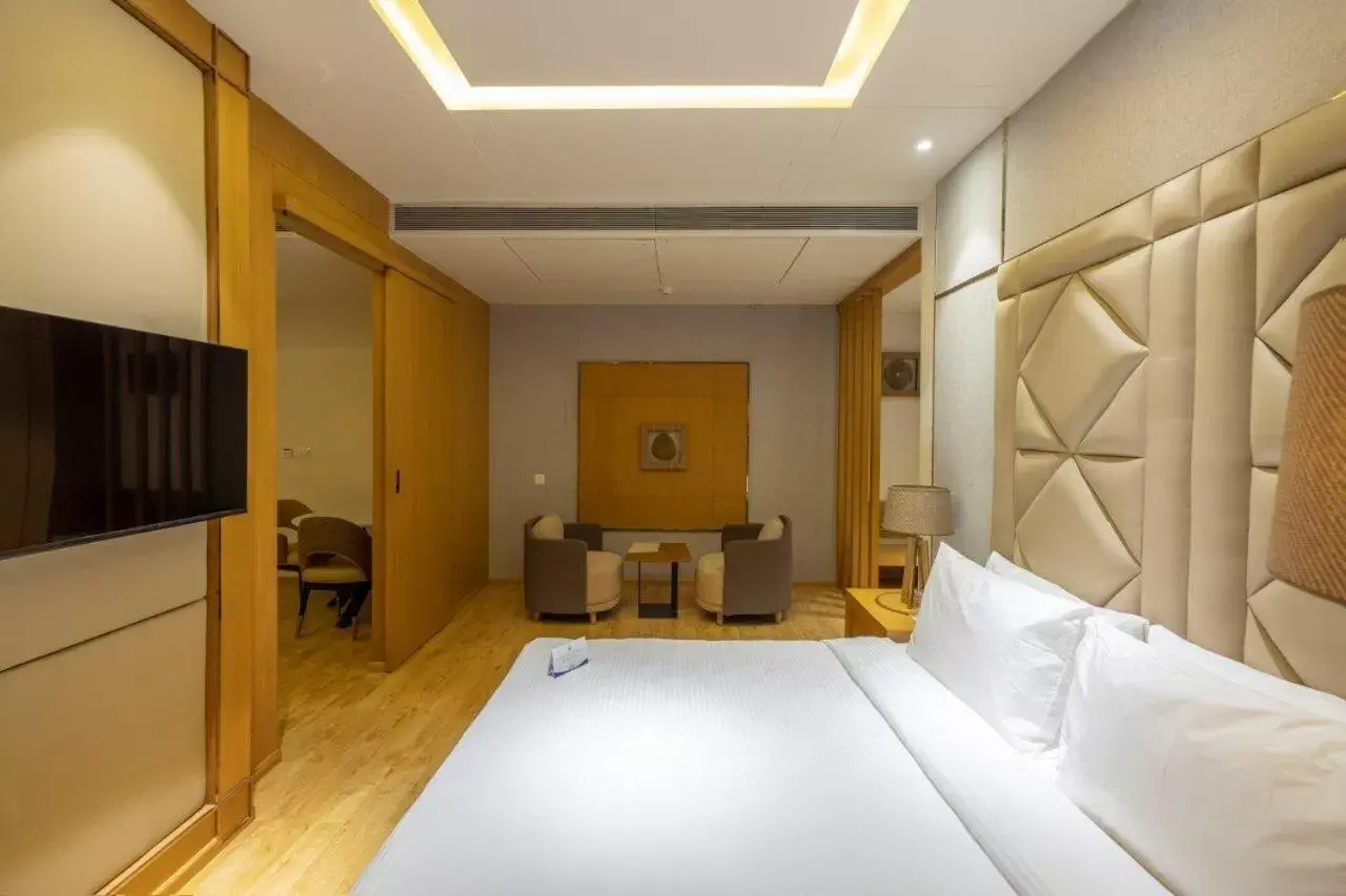 Bedroom in Sarovar Portico Morbi