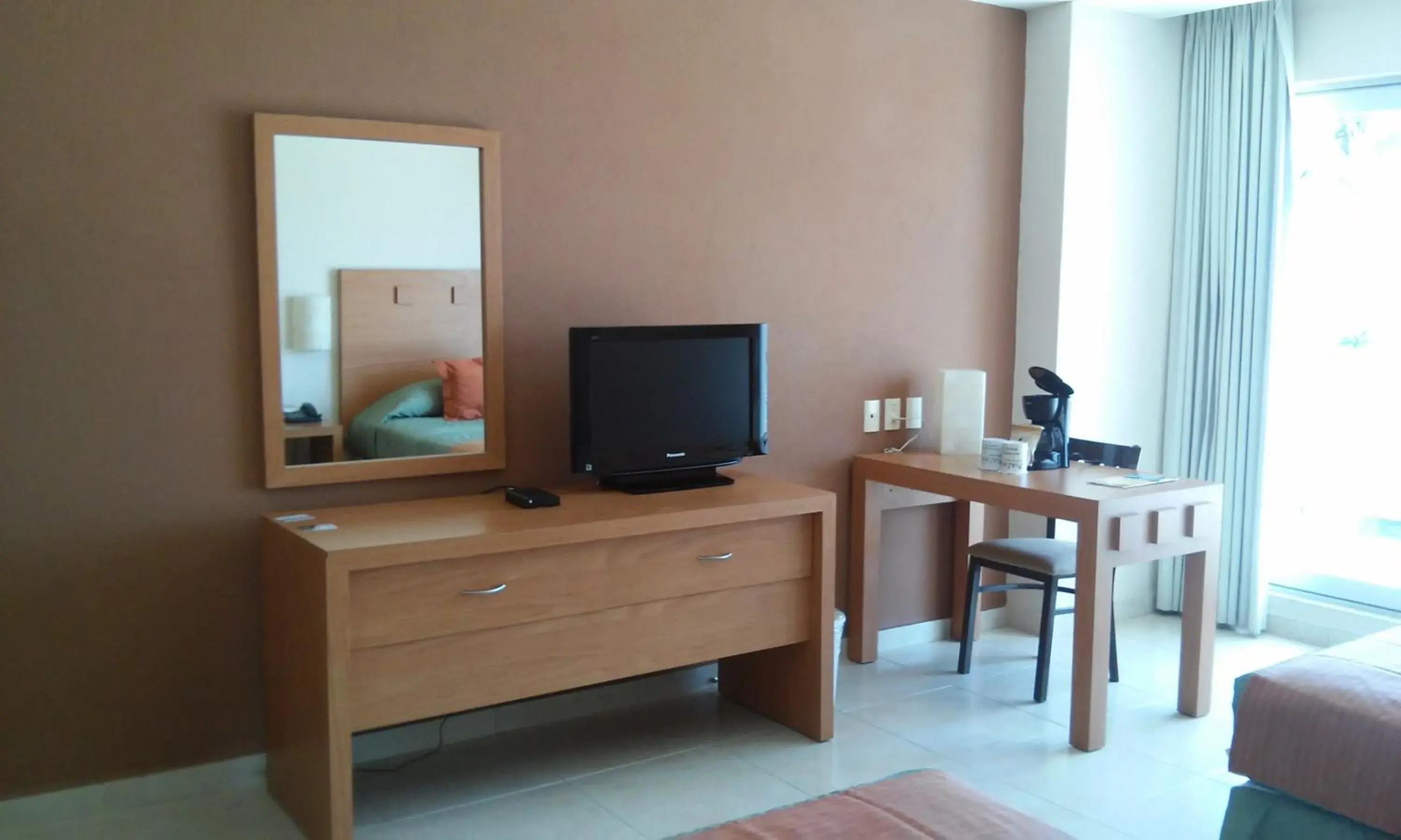 TV and multimedia, TV/Entertainment Center in Balajú Hotel & Suites