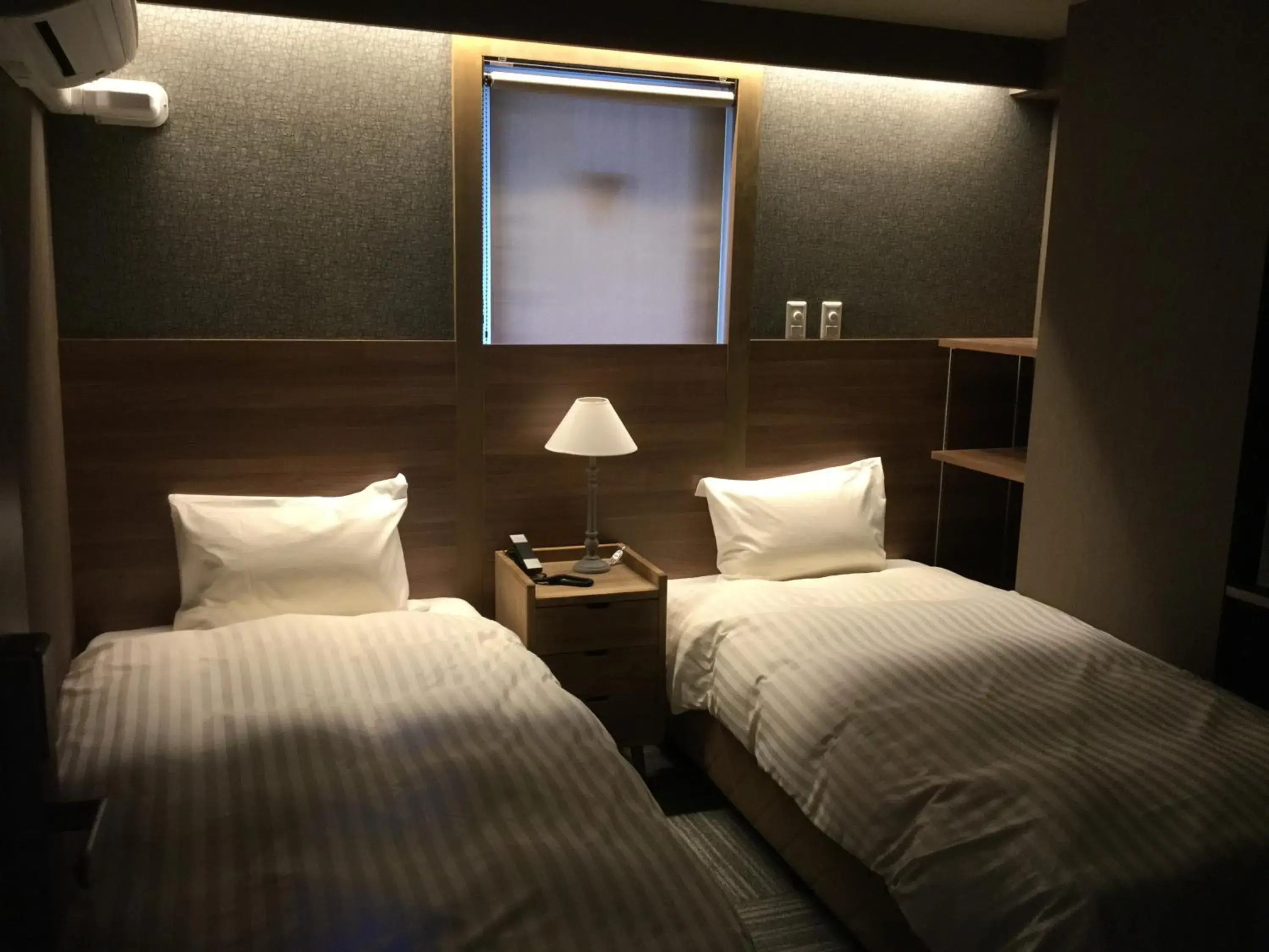 Bed in Ryuka Hotel Naha