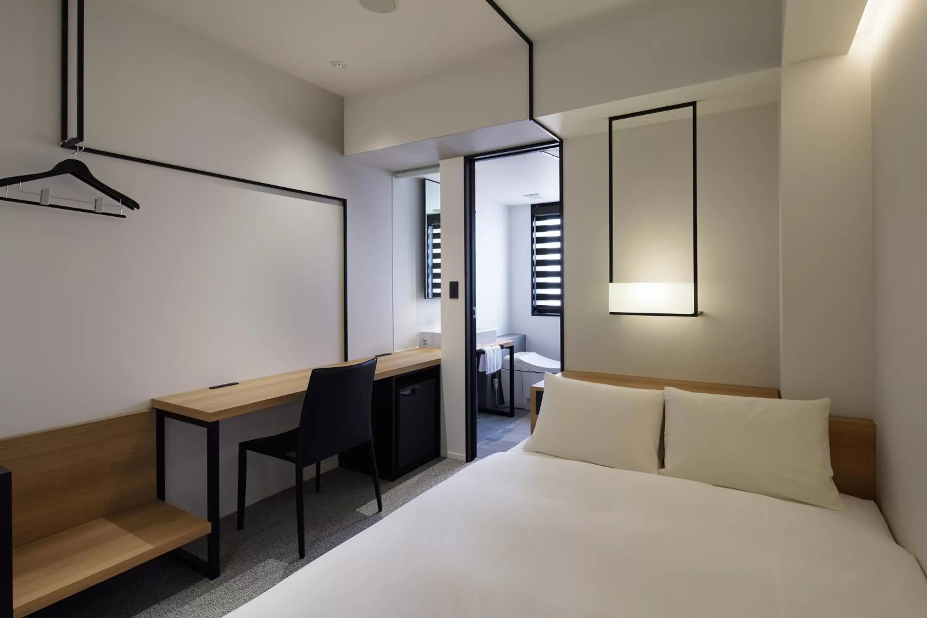 Bed in hotel androoms Nagoya Fushimi