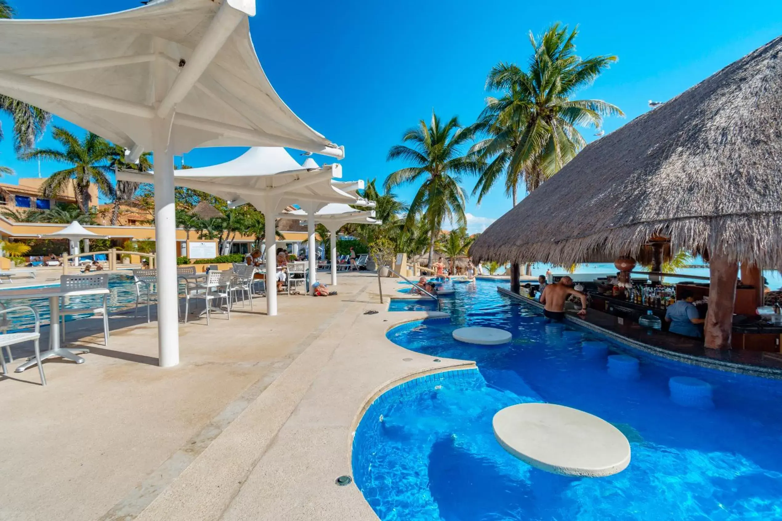 Lounge or bar, Swimming Pool in Puerto Aventuras Hotel & Beach Club