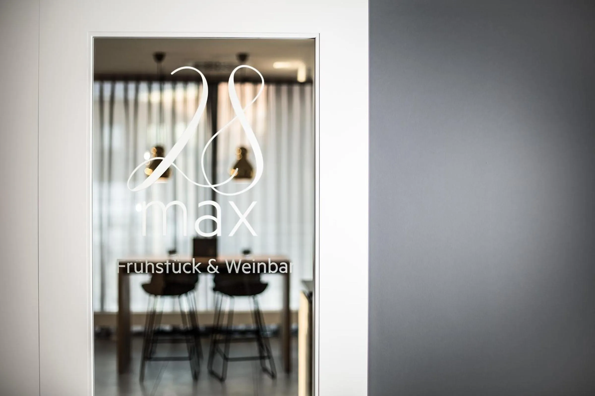 Property logo or sign in Maximilians Boutique-Hotel Landau