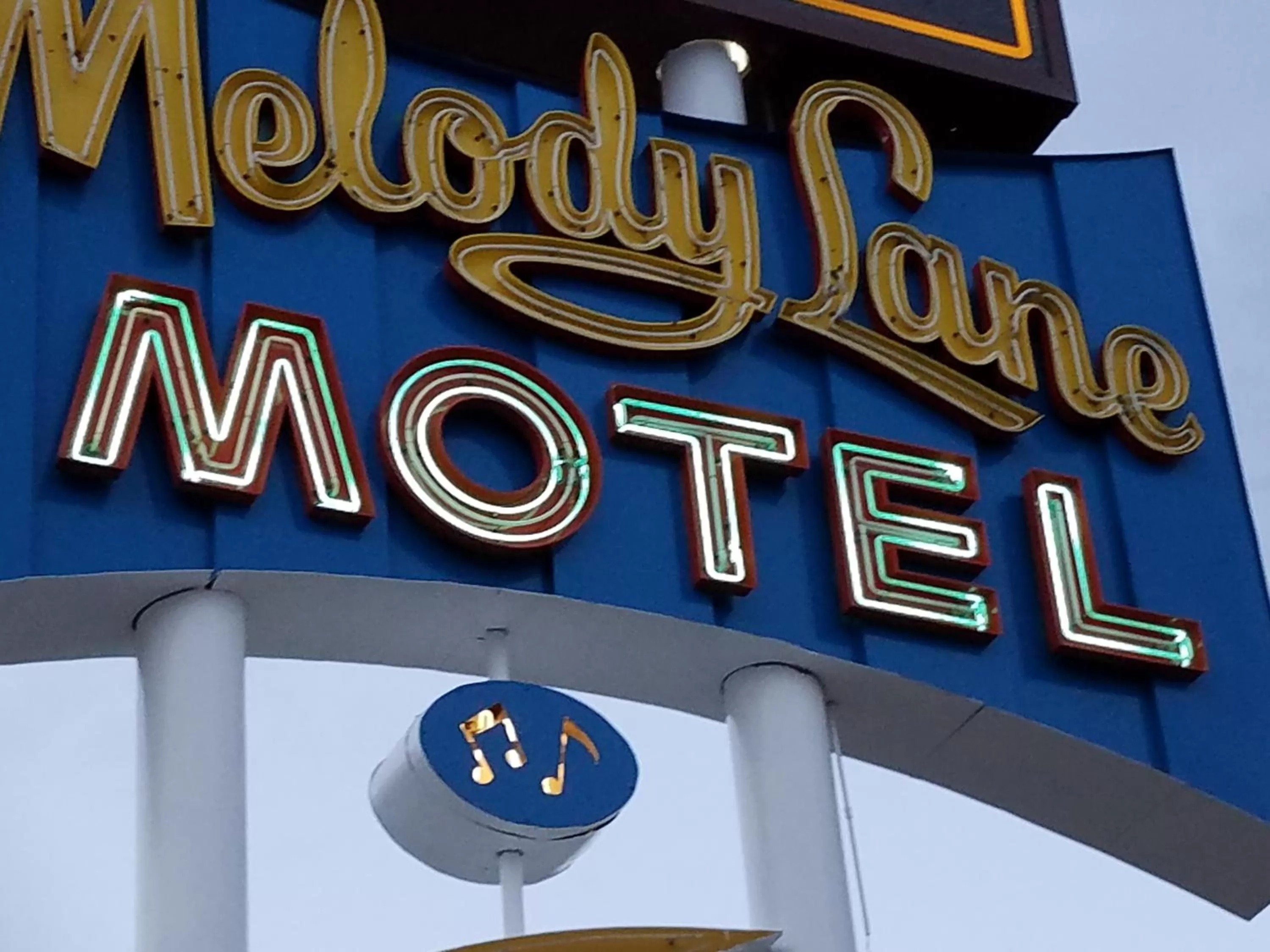 Property logo or sign in Budget Host Melody Lane