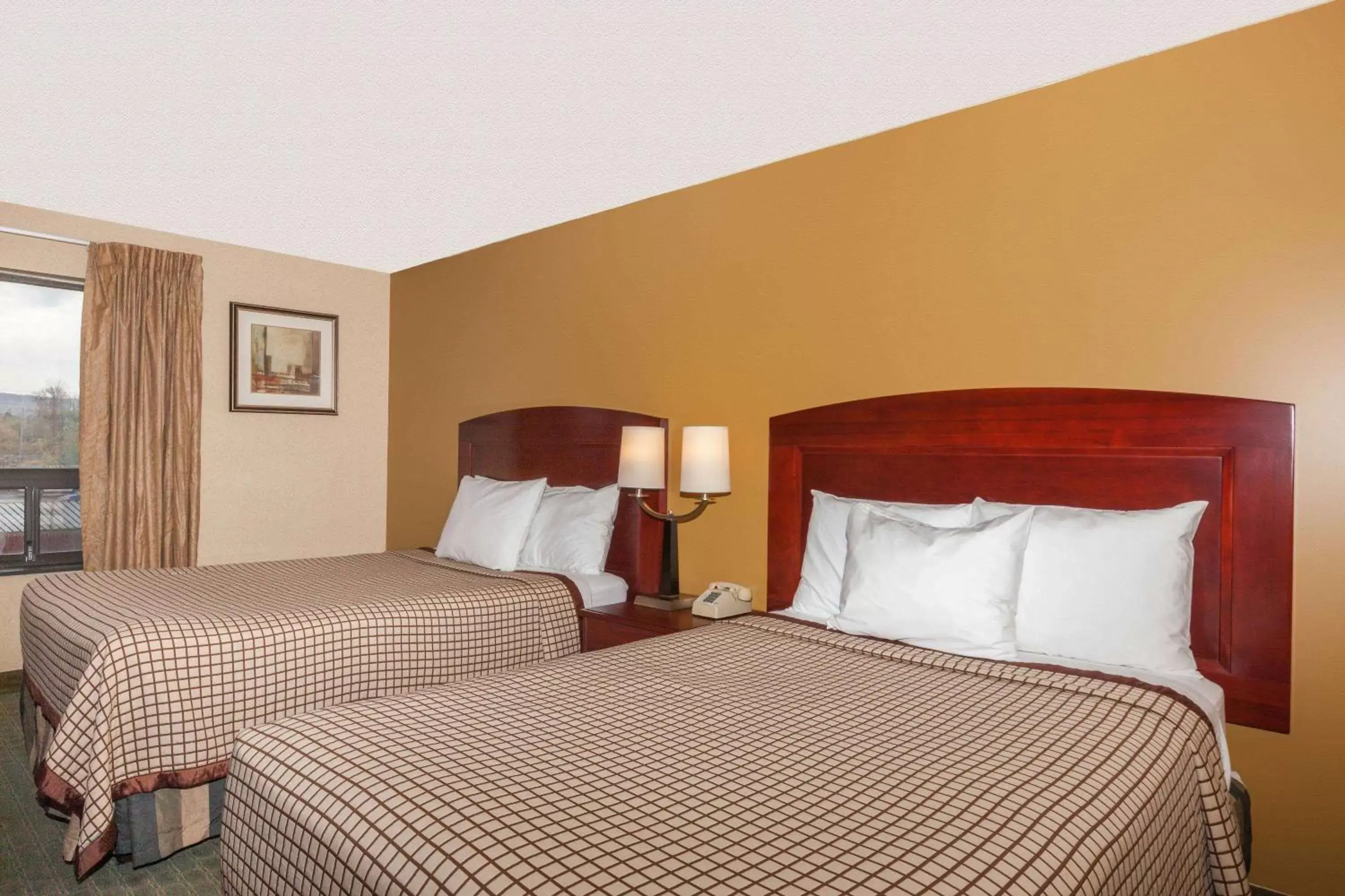 Photo of the whole room, Bed in Days Inn by Wyndham Utica