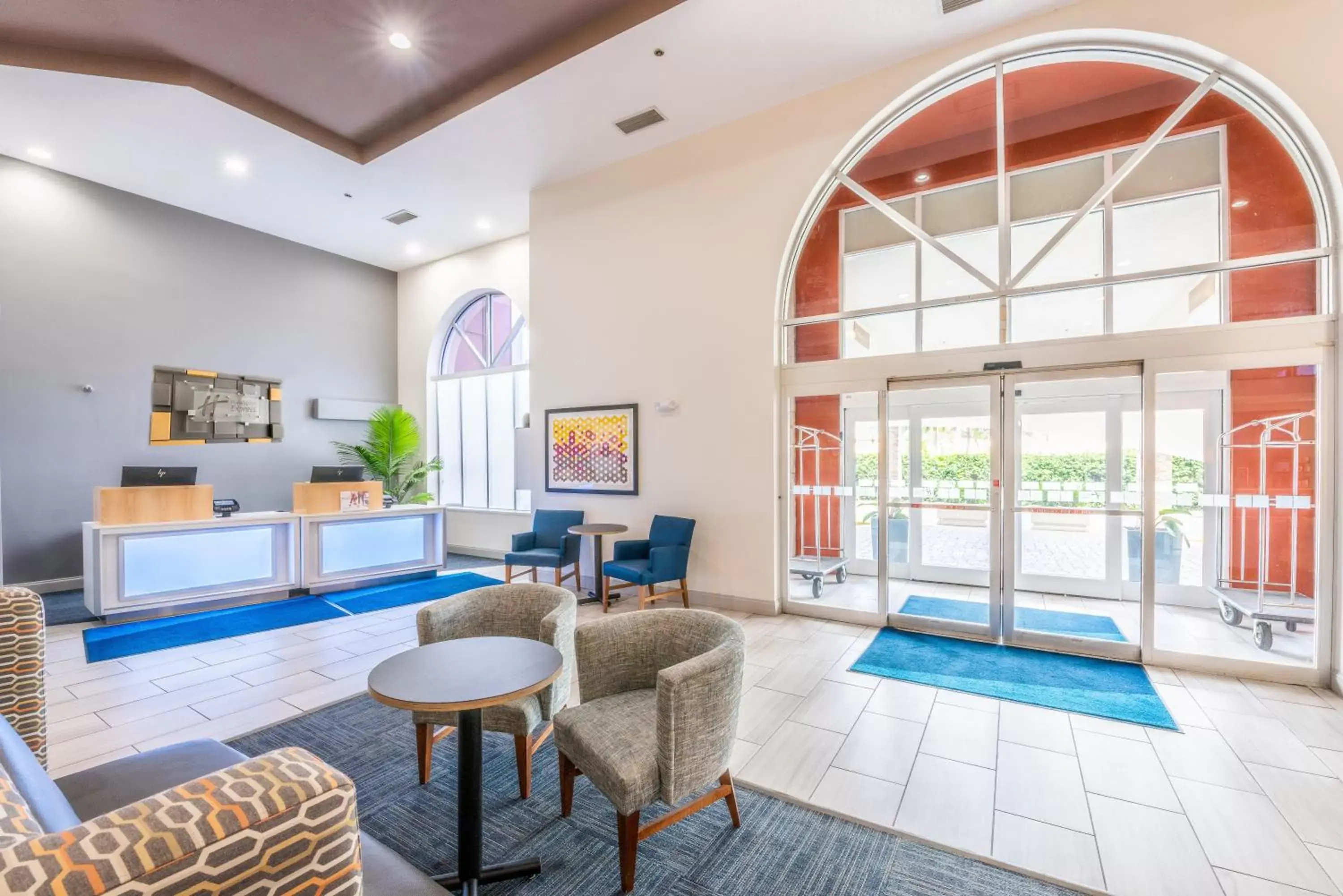 Lobby or reception, Swimming Pool in Holiday Inn Express Hotel & Suites Bradenton West, an IHG Hotel