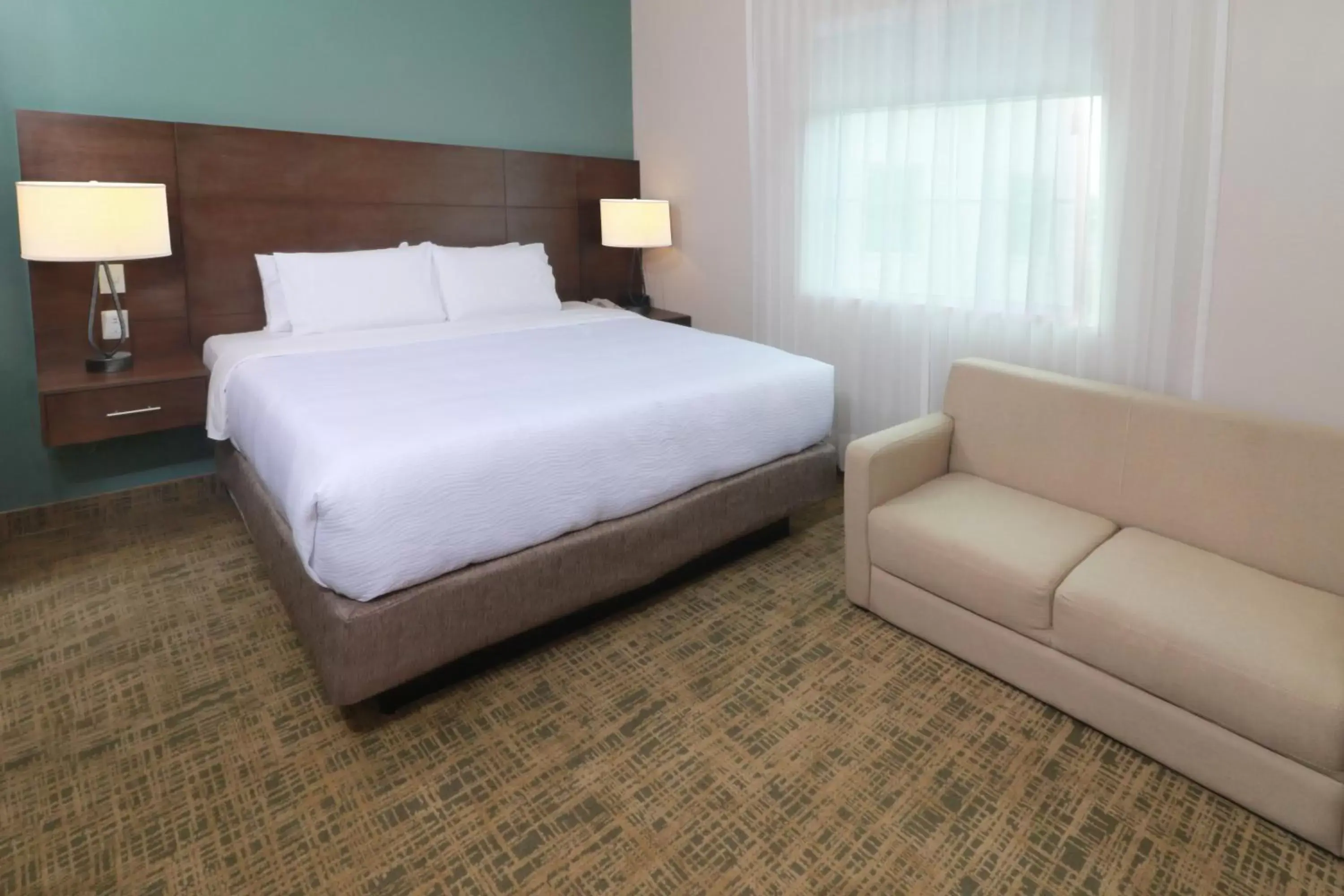 Photo of the whole room, Bed in Staybridge Suites Queretaro, an IHG Hotel