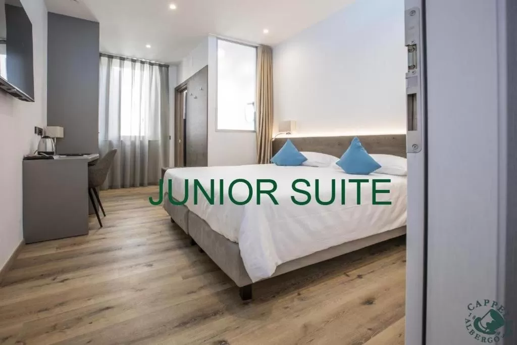 Bed in Albergo Cappello e Cadore