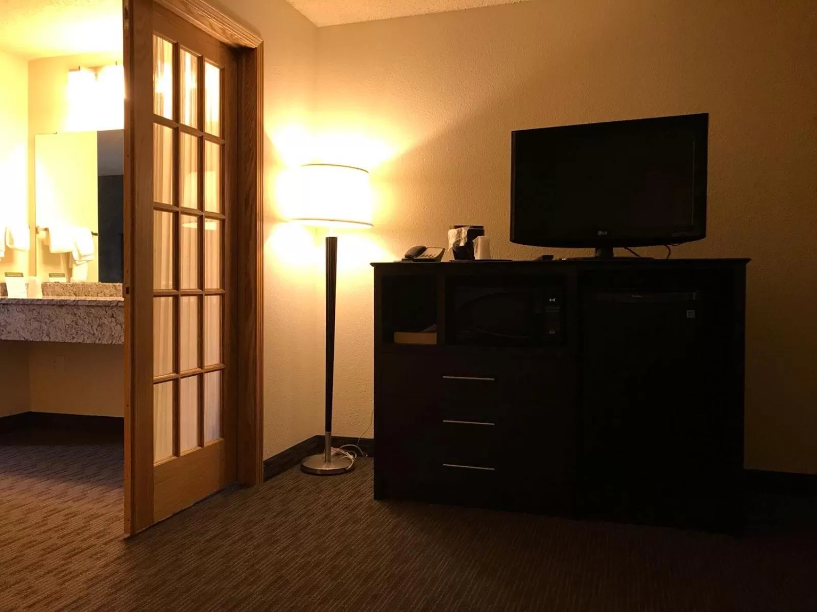 TV and multimedia in AmericInn by Wyndham Hotel and Suites Long Lake