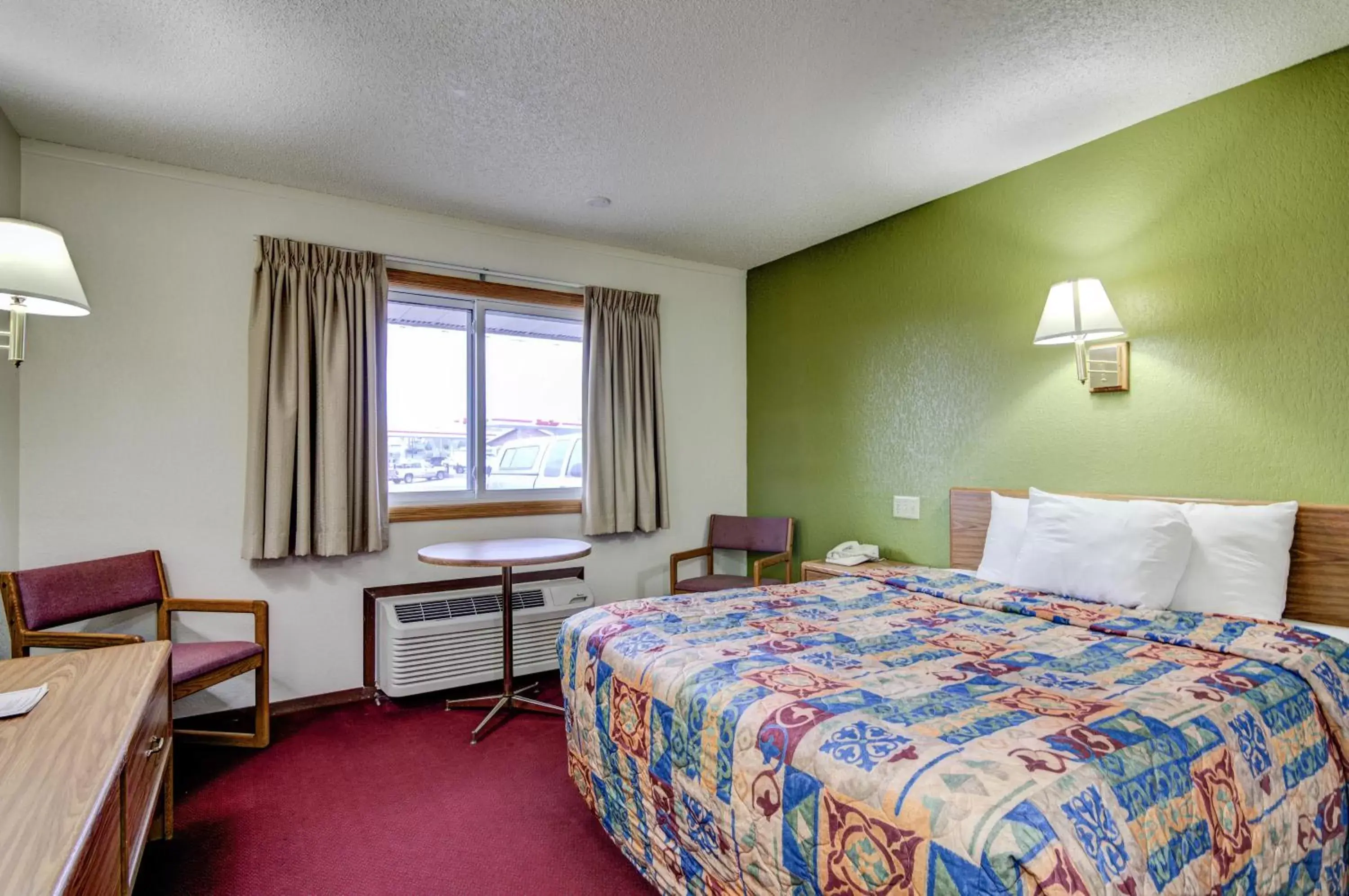 Bed in Bloomer Inn & Suites
