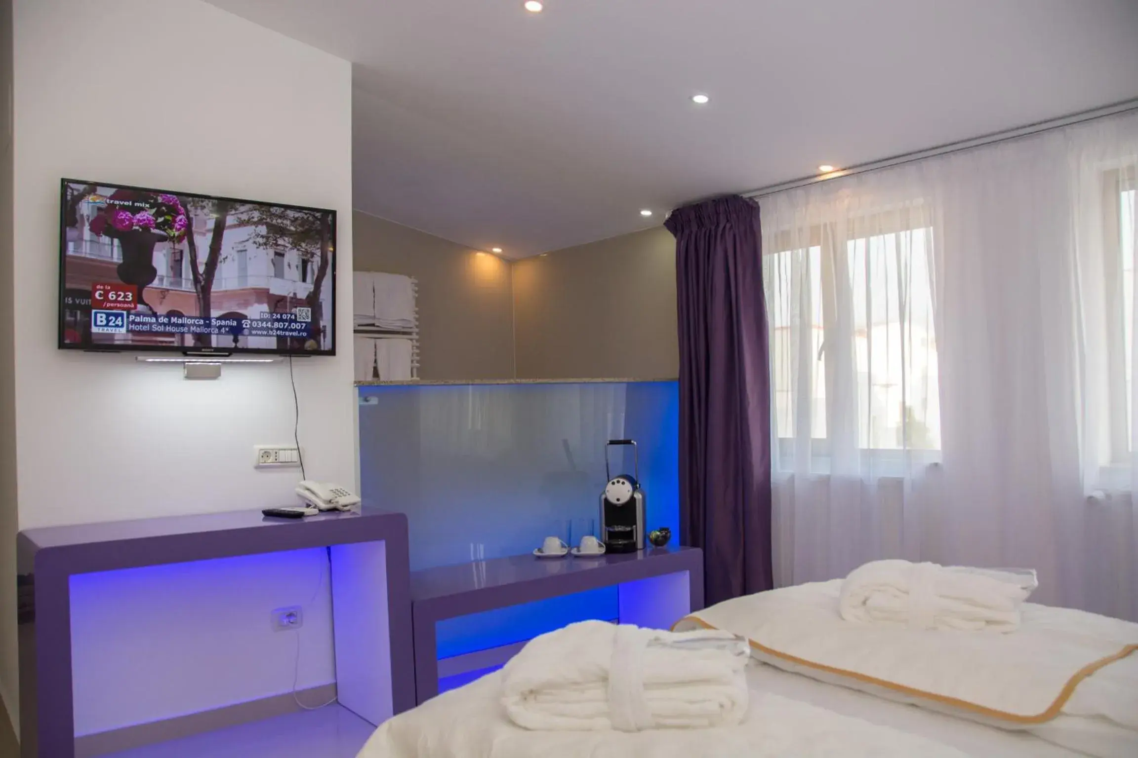 TV and multimedia, TV/Entertainment Center in Hotel Christina Plus