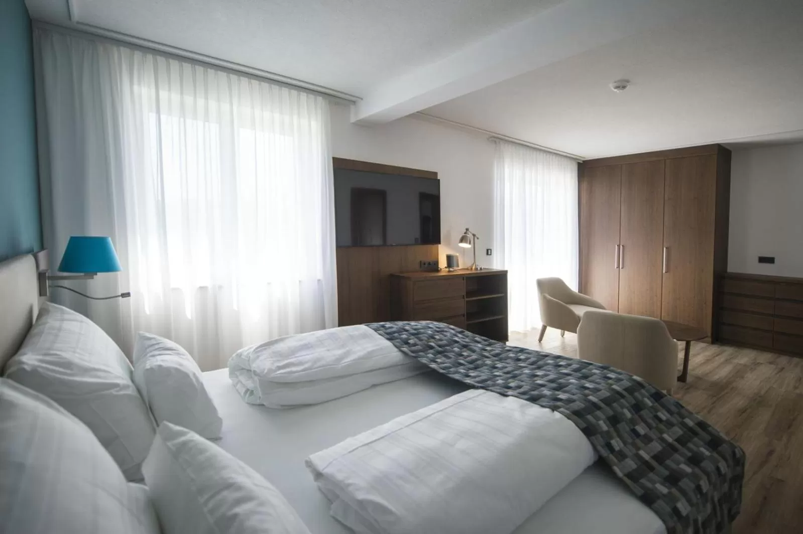 Photo of the whole room, Bed in Boutiquehotel Wörthersee - Serviced Apartments