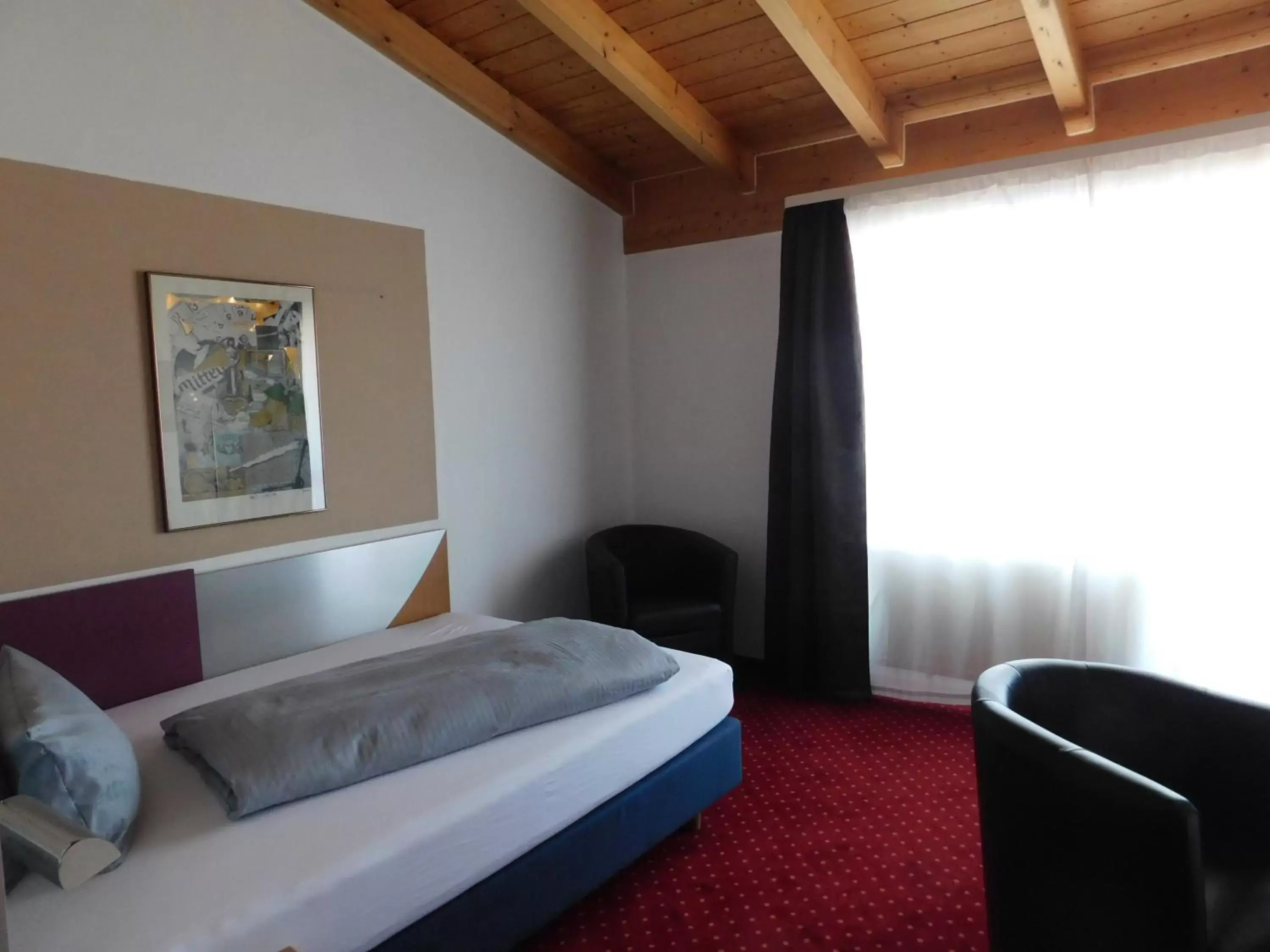 Photo of the whole room, Bed in Hotel KonradP Holzkirchen