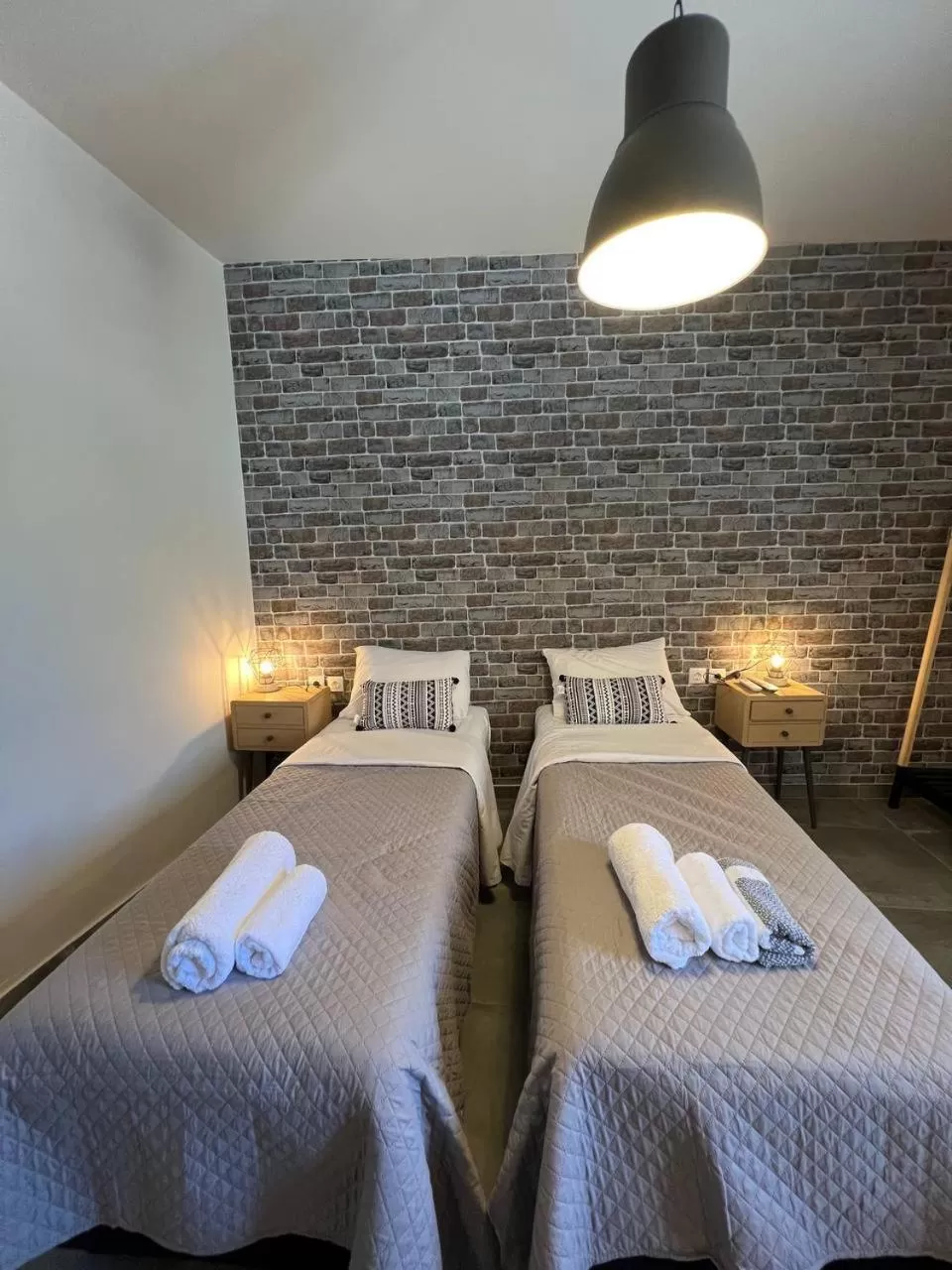 Bed in Elefsinian Mysteries Apartments