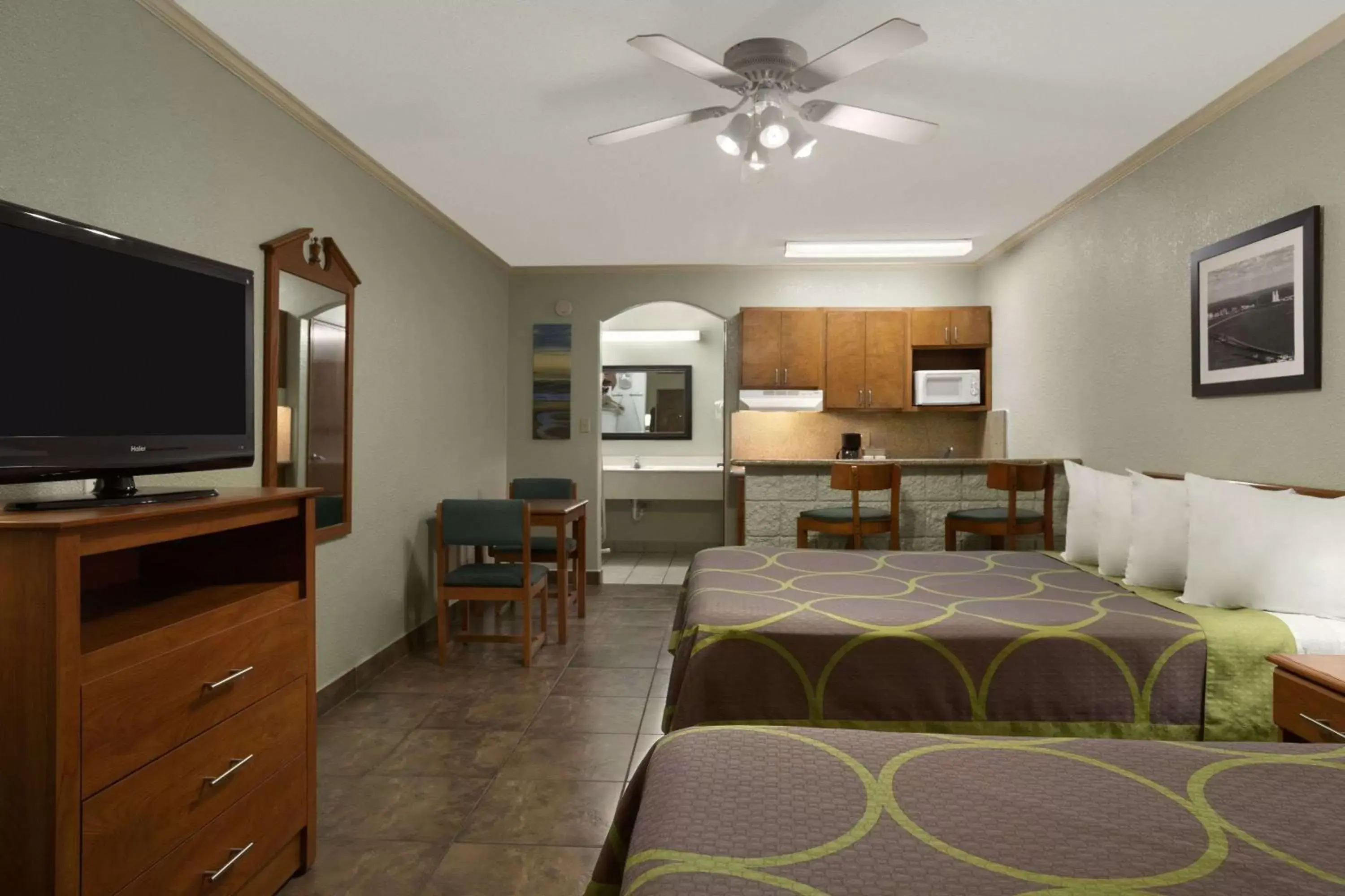 Photo of the whole room, TV/Entertainment Center in Super 8 by Wyndham South Padre Island