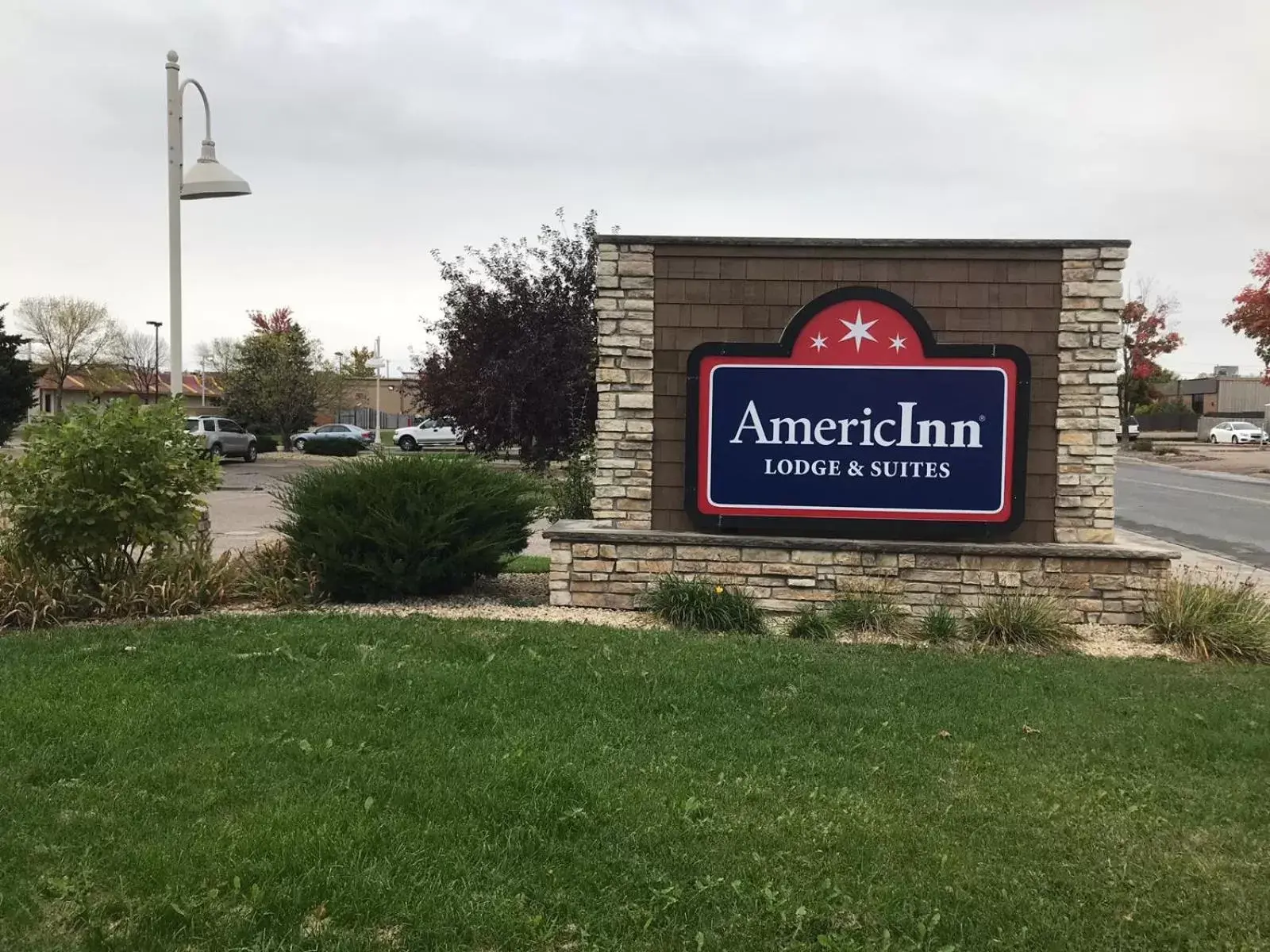 Property logo or sign in AmericInn by Wyndham Hotel and Suites Long Lake