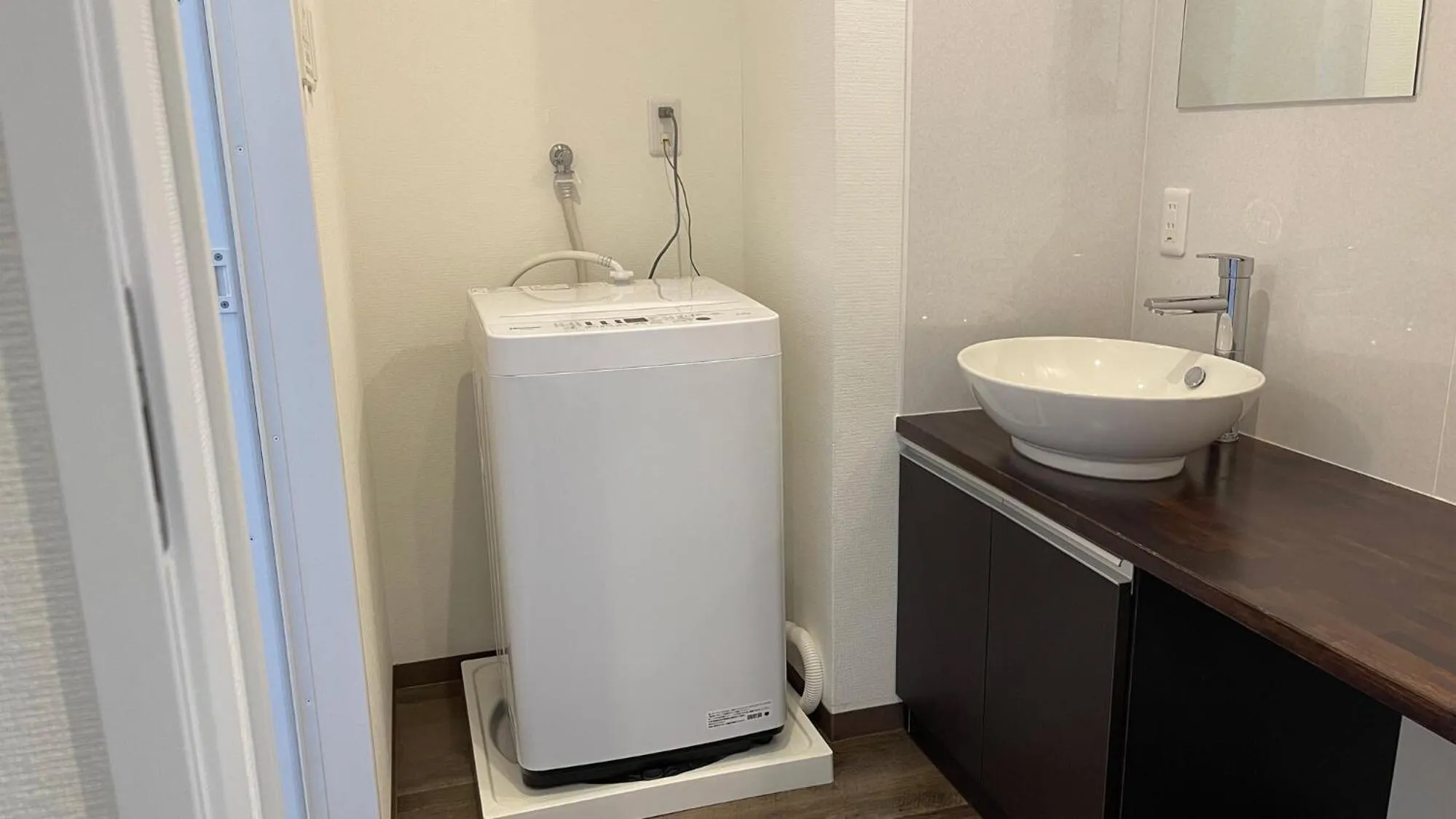 Bathroom in New Normal Hotel in NAMINOUE ニューノーマルホテルイン波の上