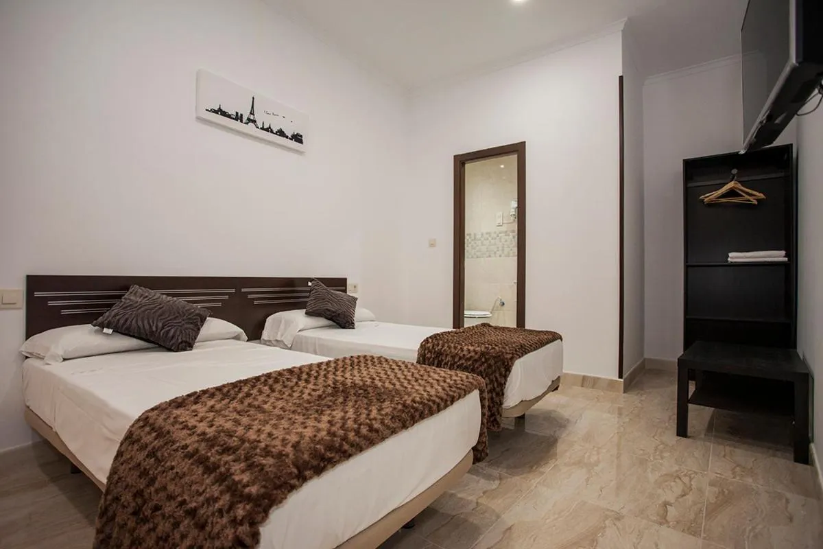Photo of the whole room, Bed in Hostal Rincón de Sol - Centro Madrid - Self Checkin