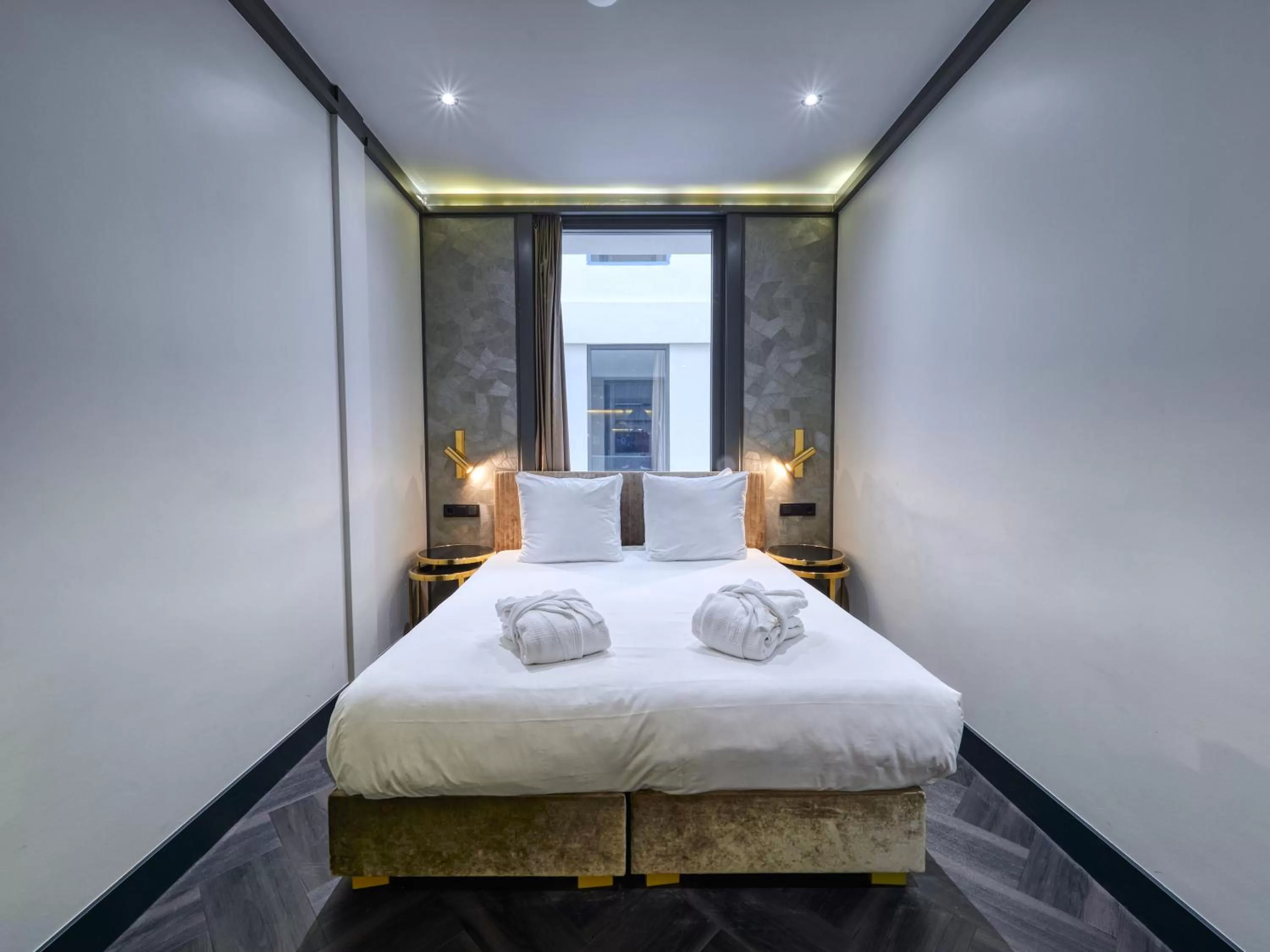 Bed in Triple G Hotels