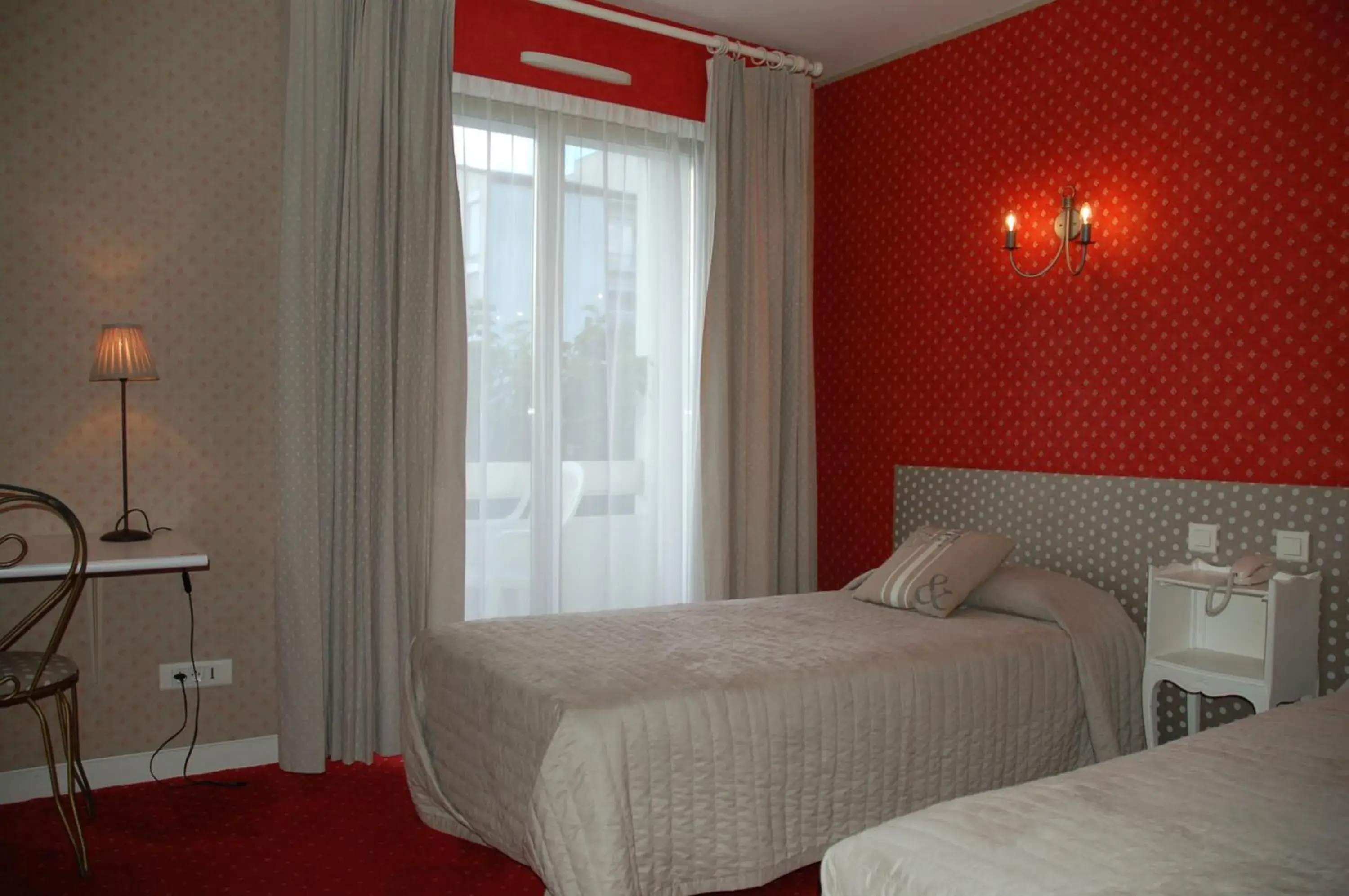 Photo of the whole room, Bed in Hôtel de L'Avenue